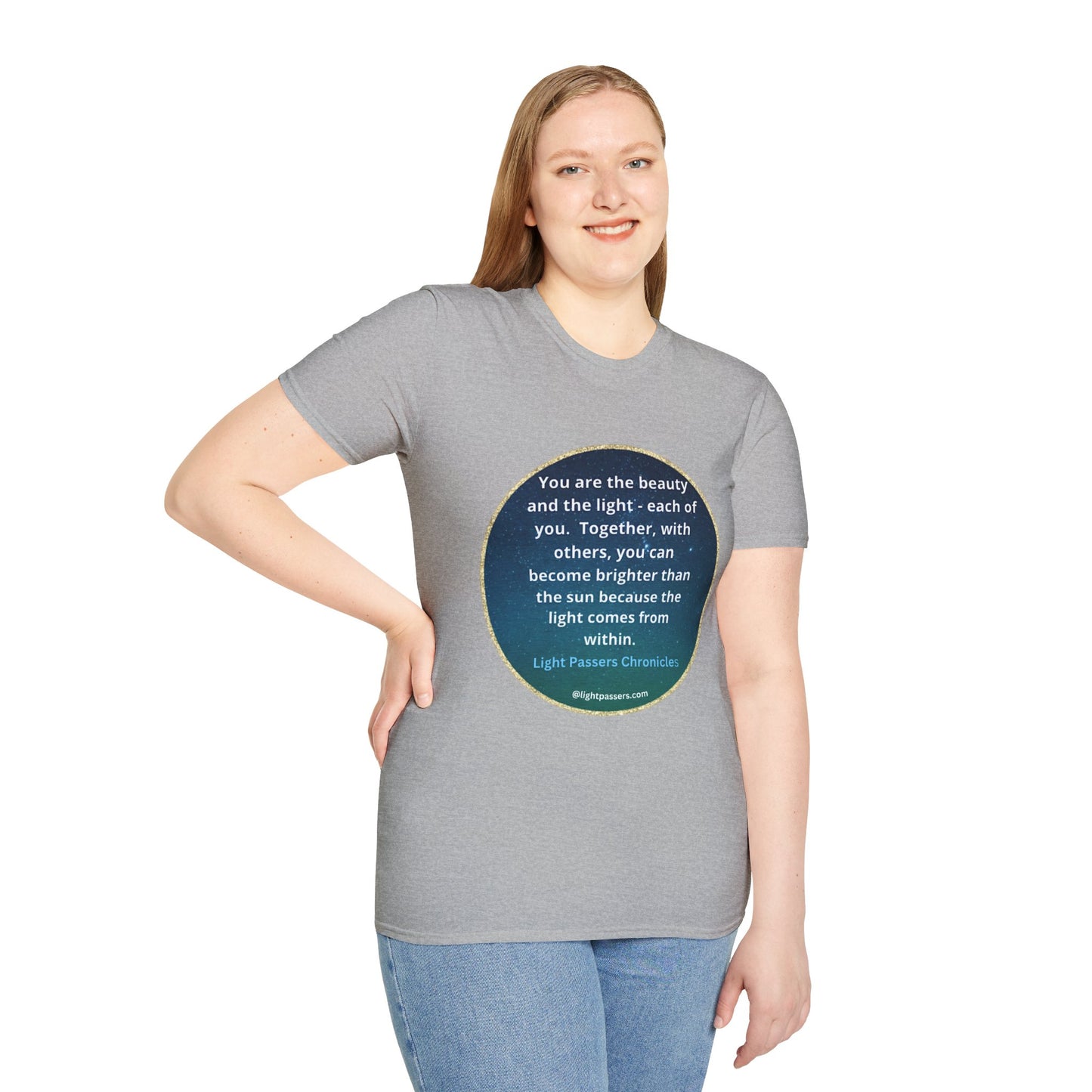 A woman in a grey shirt smiles, showcasing the Beauty and the Light Unisex T-shirt. Close-up of blue jeans. Casual, 100% cotton tee with no side seams for comfort.
