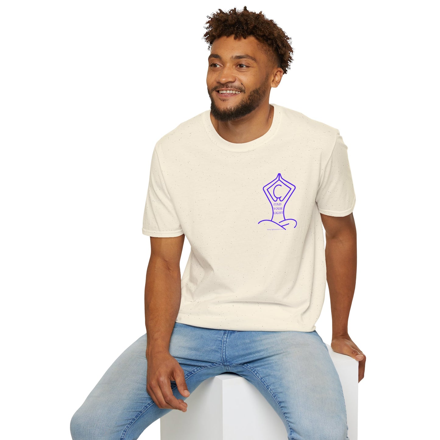 A man in a white shirt sits on a cube, showcasing the Yoga Find Your Light Unisex T-Shirt. Soft, 100% cotton tee with twill tape shoulders and ribbed collar for durability and comfort.