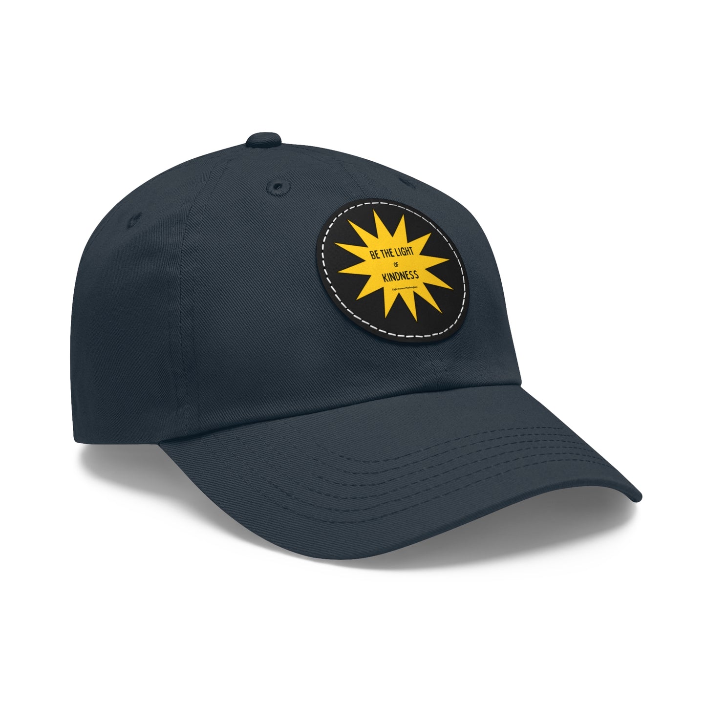Unisex hat with 'Be the Light of Kindness' yellow sun patch on black, featuring buckle closure and durable chino twill fabric.
