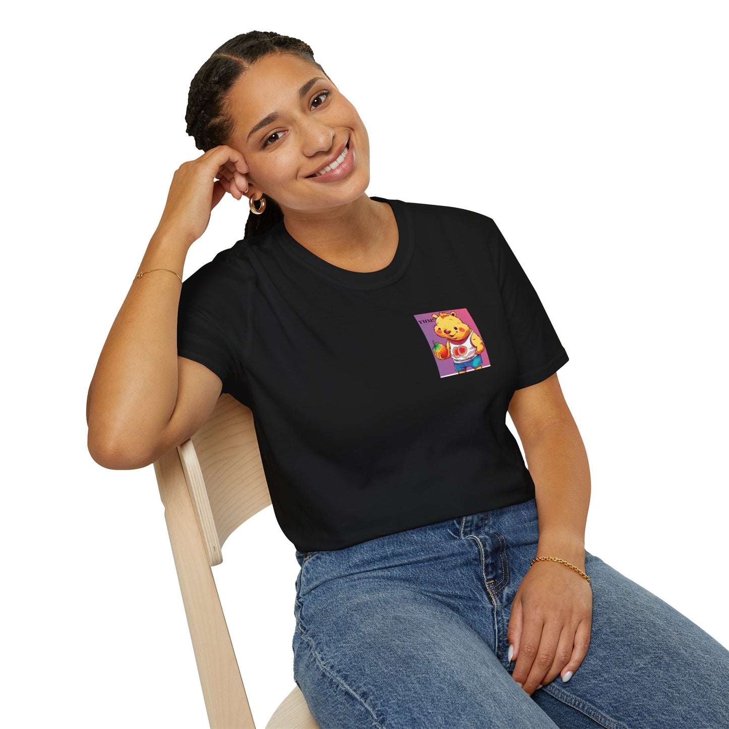 A woman in a black shirt sitting on a chair, smiling with a hand on her lap. Yum Strawberries Unisex T-Shirt, 100% ring-spun cotton, lightweight fabric, tear-away label, ethically made by Gildan.