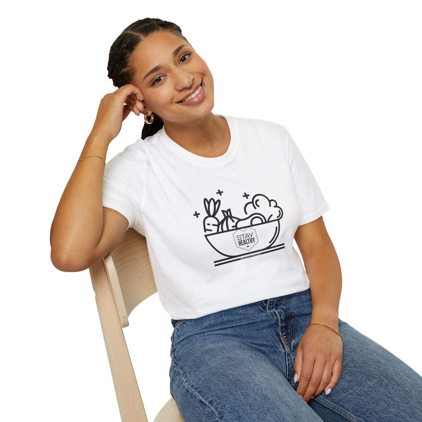 A woman in a white shirt smiling, sitting on a chair, showcasing the Stay Healthy Unisex T-Shirt's casual comfort and durable design. Made from soft 100% cotton, with twill tape shoulders and ribbed collar.