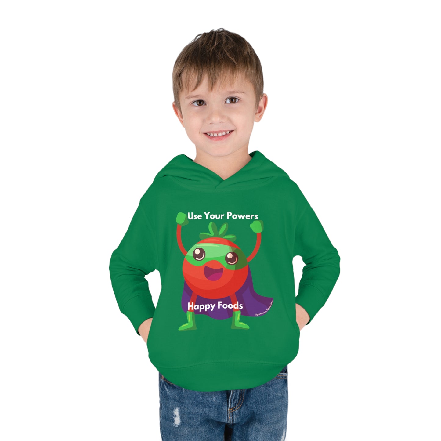 A toddler in a Tomato Power hoodie with a cartoon strawberry design, featuring side-seam pockets and double-needle stitching for durability and comfort.