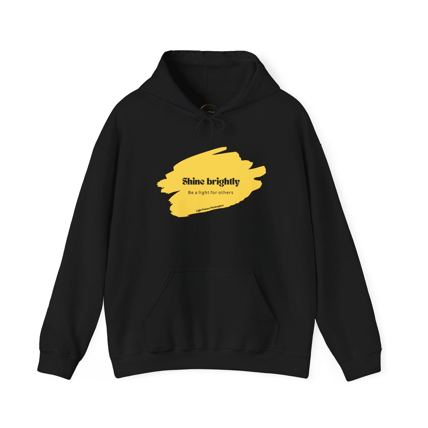 The Light Inspirational Hoodie - Shine Brightly Adult Unisex Heavy Blend™ Sweatshirt, featuring a yellow paint stroke and positive text design on a black background.