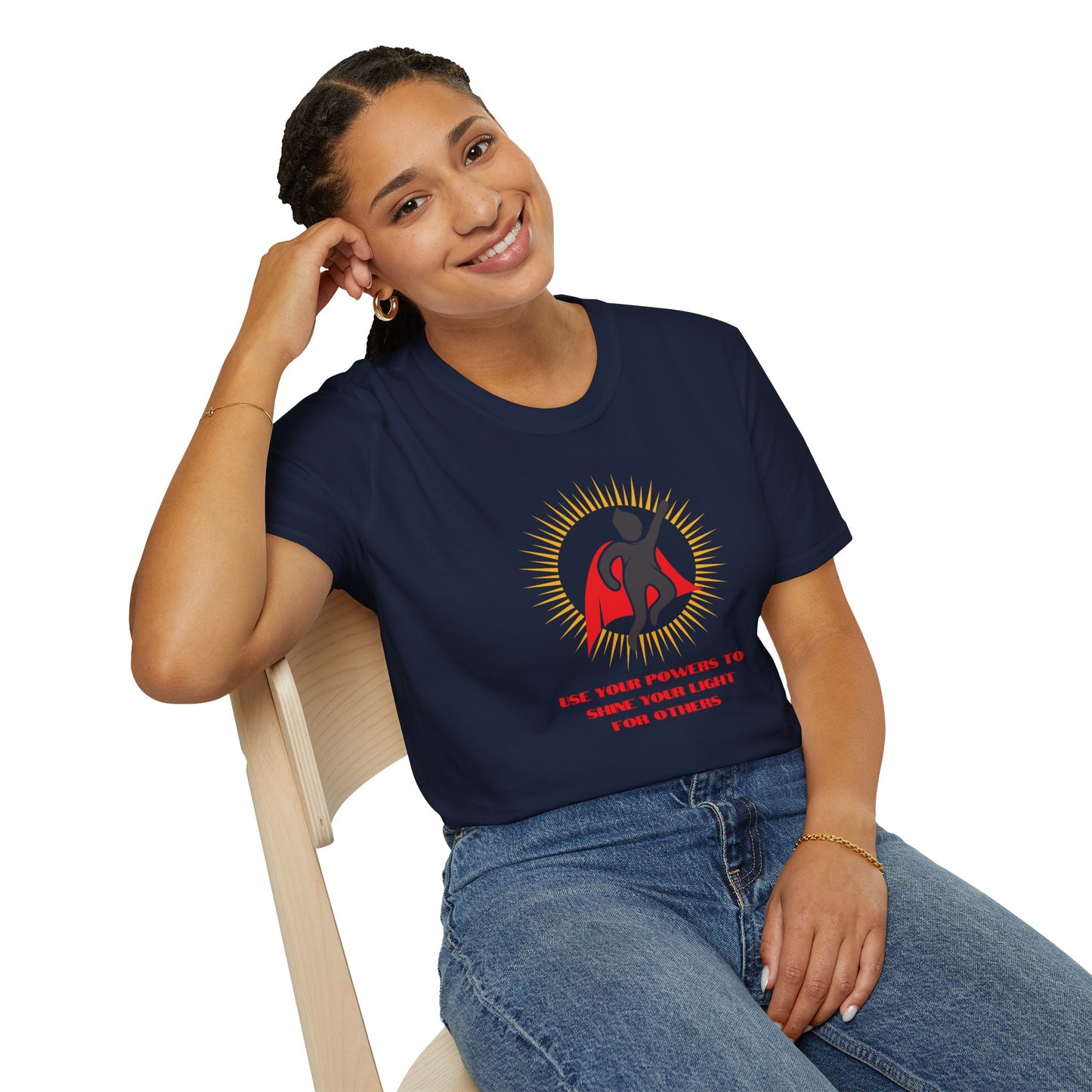 A smiling woman in a blue shirt sits on a chair, showcasing the Use Your Powers Unisex T-shirt. The image captures a casual, comfortable tee perfect for everyday wear.