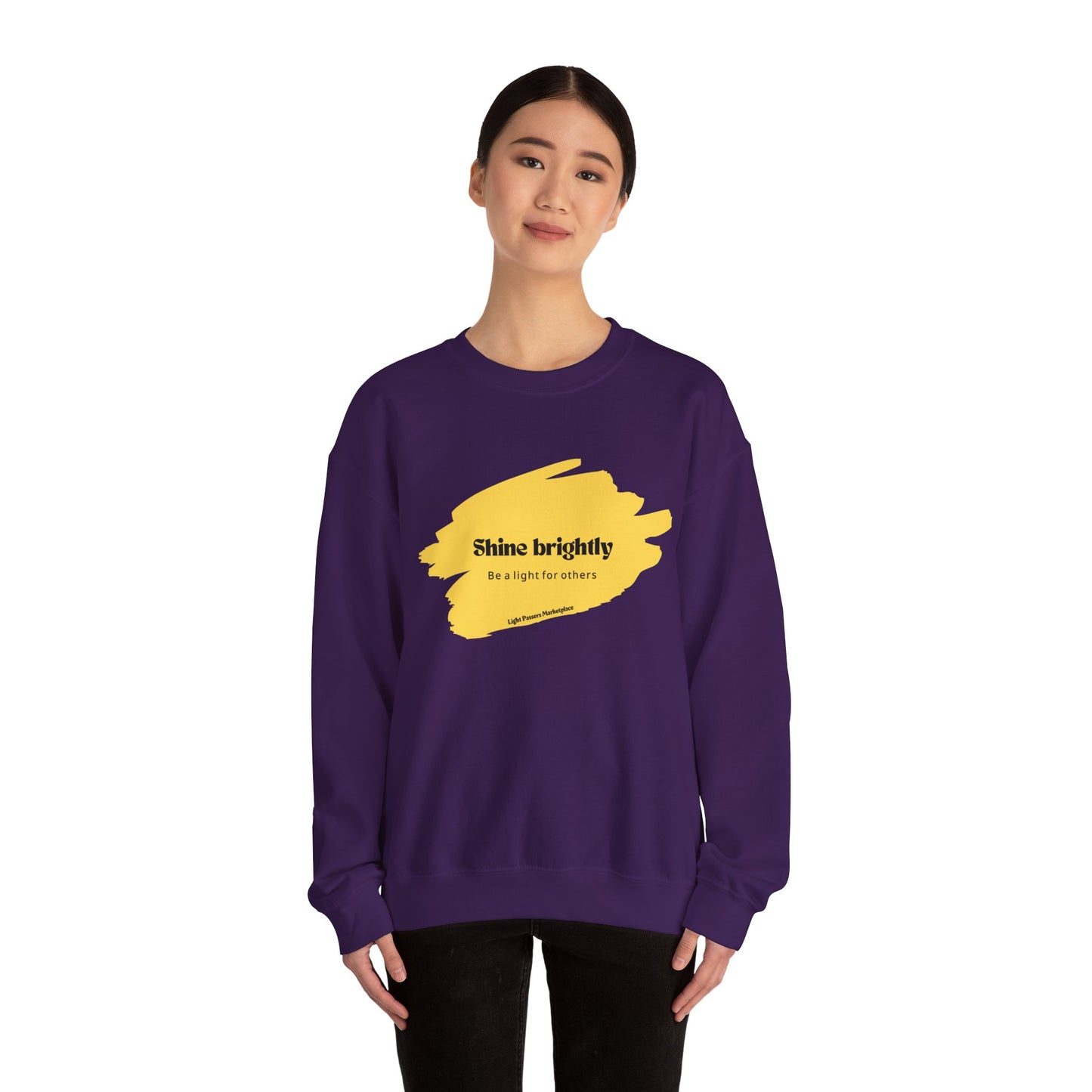 Woman wearing The Light Inspirational Crewneck Sweatshirt Adult Unisex, showcasing its cozy fit and uplifting message for casual, positive vibes.