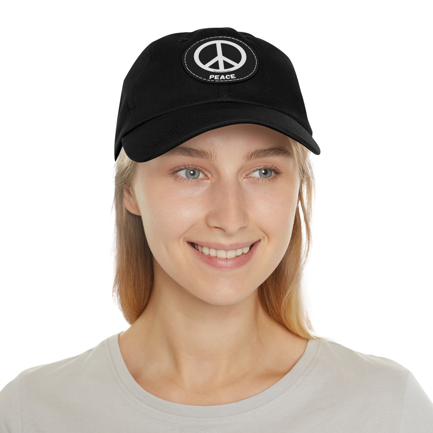 Unisex Hat with Leather Patch (Round) featuring a peace symbol, made from bio-washed chino twill, unstructured with a low-profile design.