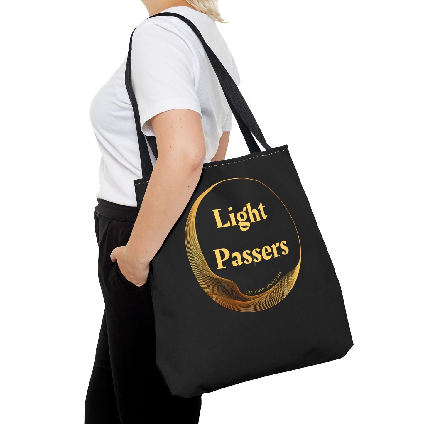 Cool Stuff Accessories Light Passers Gold Logo Tote Bag, black with logo, carried by a person, showcasing durable polyester and stylish design, available in three sizes.