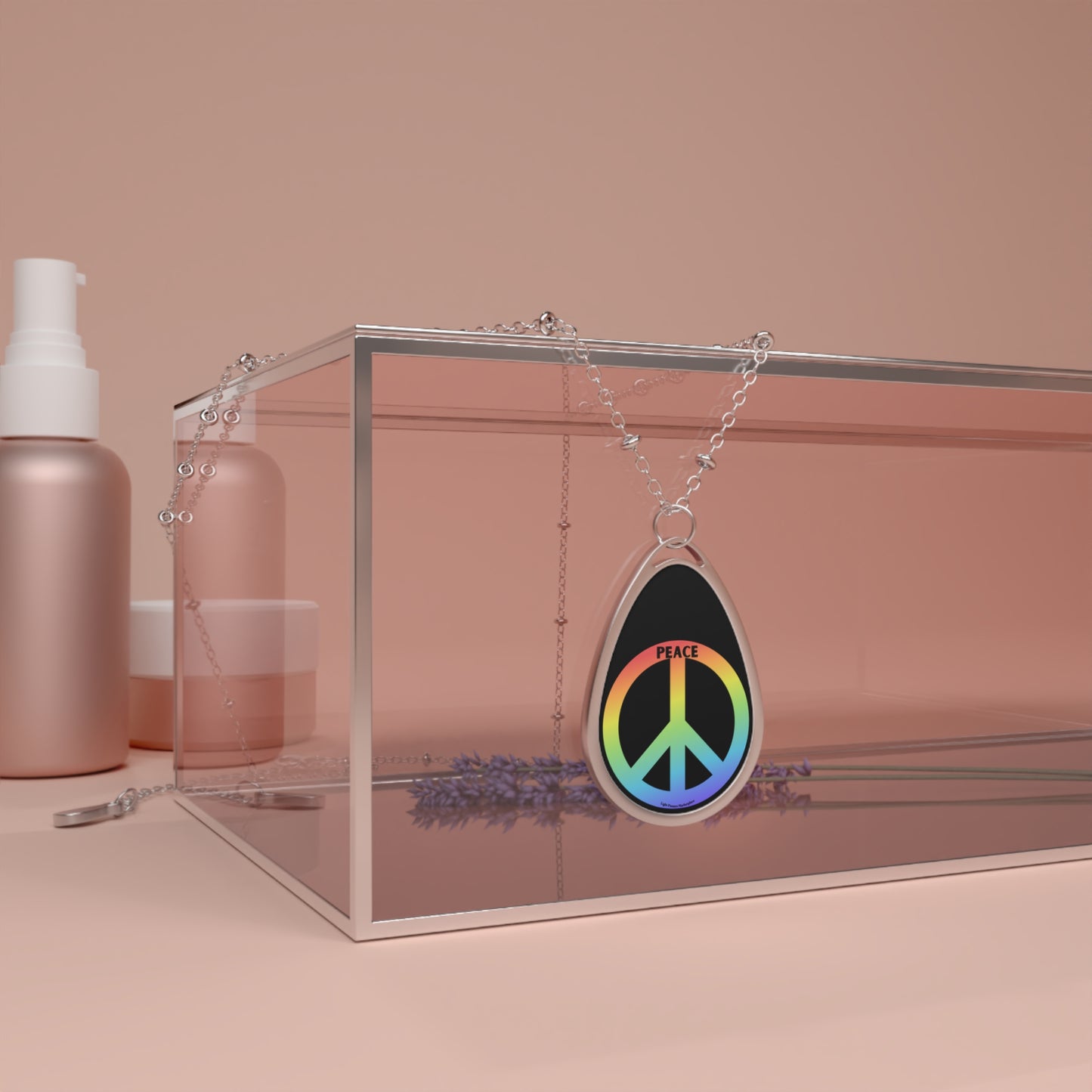 Peace Necklace with silver chain and Oval Peace Symbol Pendant in a glass case, accompanied by a lavender flower, showcasing a polished, vibrant finish.