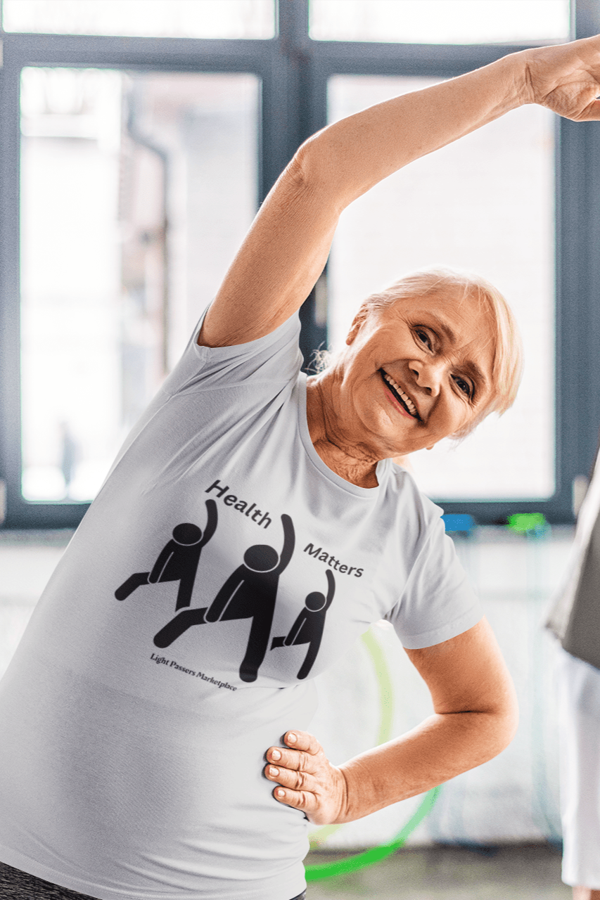 Three people stretching in a soft 100% cotton unisex t-shirt with twill tape shoulders, no side seams, and ribbed collar. Lightweight and versatile for year-round comfort. Ethically made with US cotton.