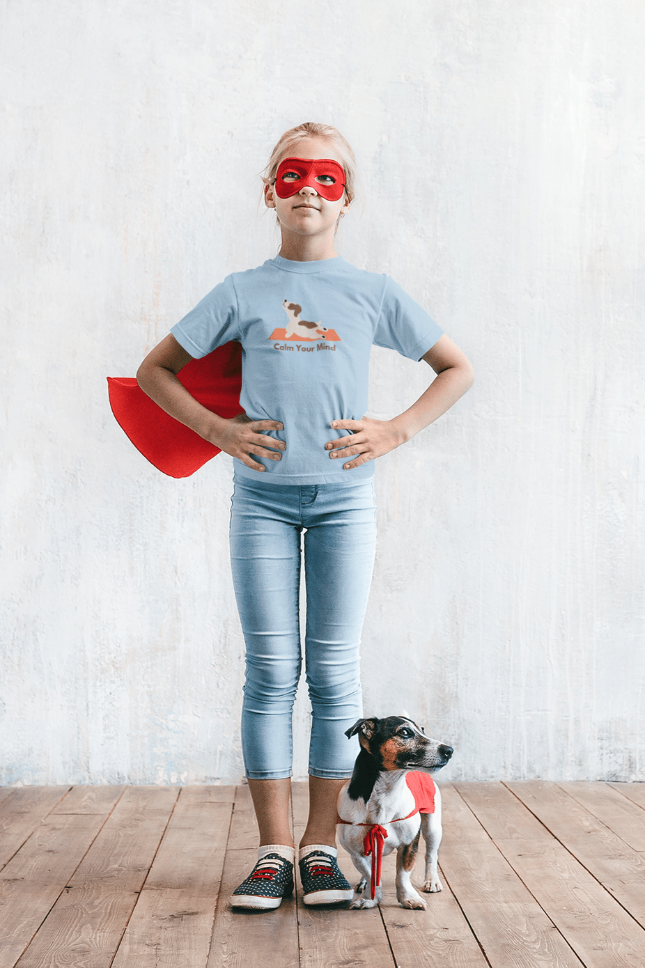 A girl in a superhero garment stands with a dog. Kids heavy cotton tee, 100% cotton, twill tape shoulders, curl-resistant collar, no side seams, ethically made, Oeko-Tex certified.
