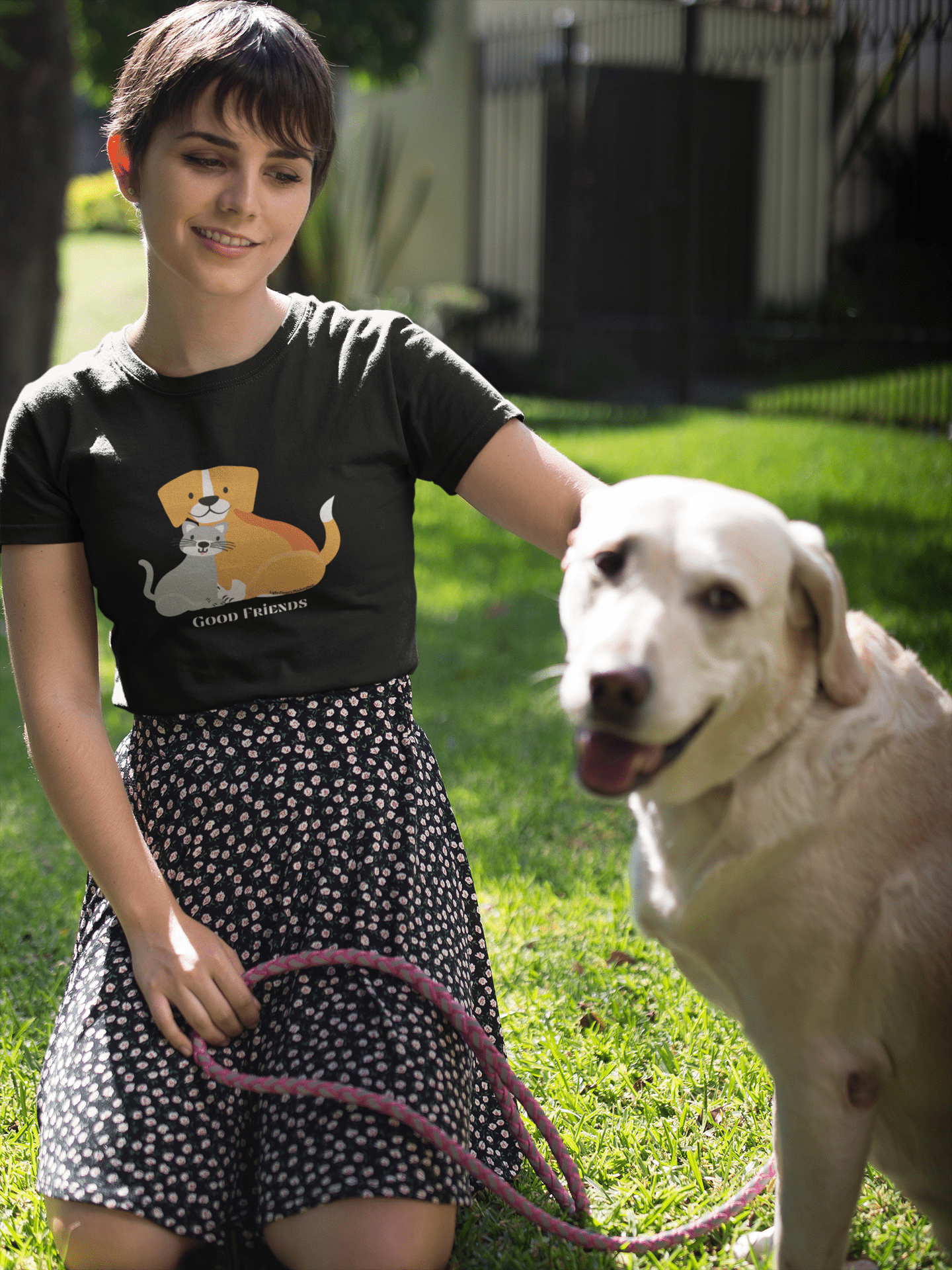 A youth cotton t-shirt featuring a woman with a dog, perfect for everyday wear. Made with 100% US cotton, twill tape shoulders, and curl-resistant collar. Ethically produced with tear-away labels for comfort.