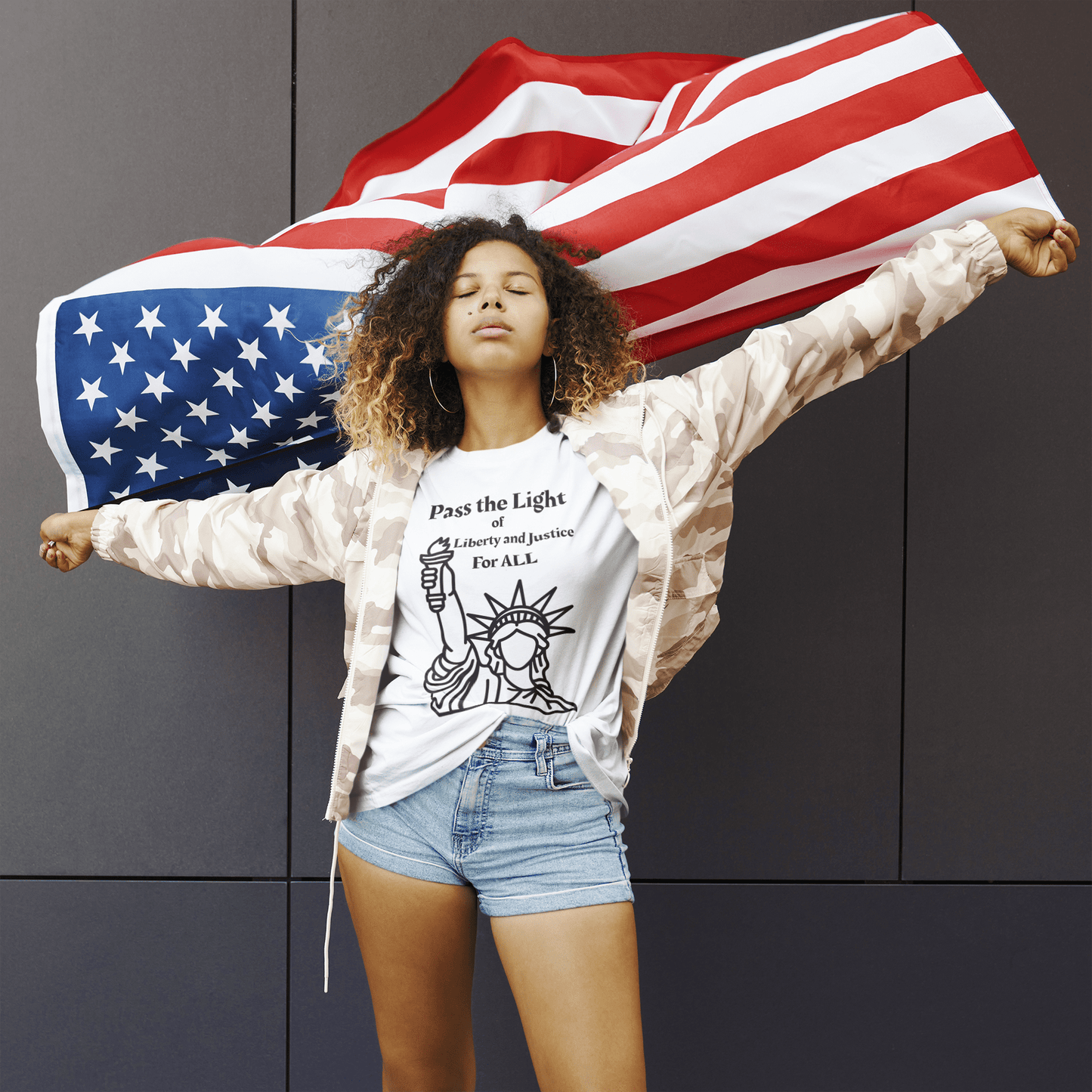The Light- Liberty and Justice Adult Unisex Softstyle T-Shirt, featuring a Pass the Light design, ideal for expressing social justice values.