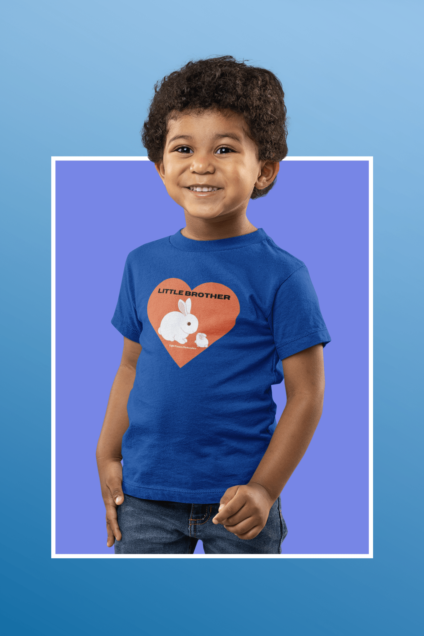 A smiling toddler boy in a soft, durable Little Brother Toddler T-shirt. 100% combed cotton, light fabric, tear-away label, classic fit, true to size.