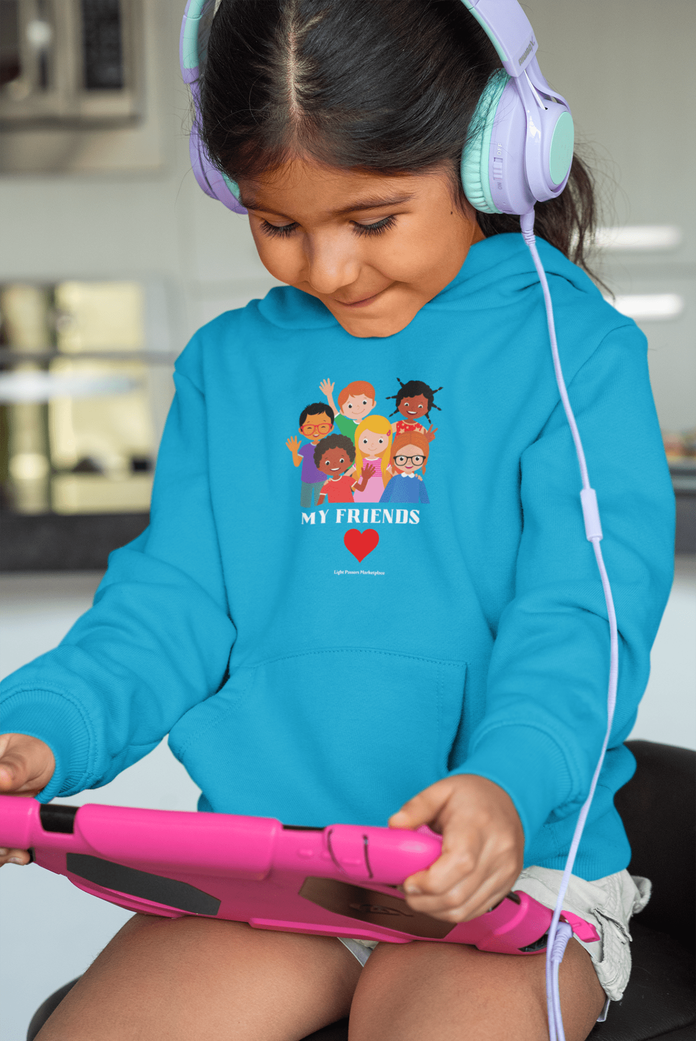 A toddler wearing a Rabbit Skins My Friends Toddler Hoodie with side seam pockets, jersey-lined hood, and cover-stitched details for durability and comfort.