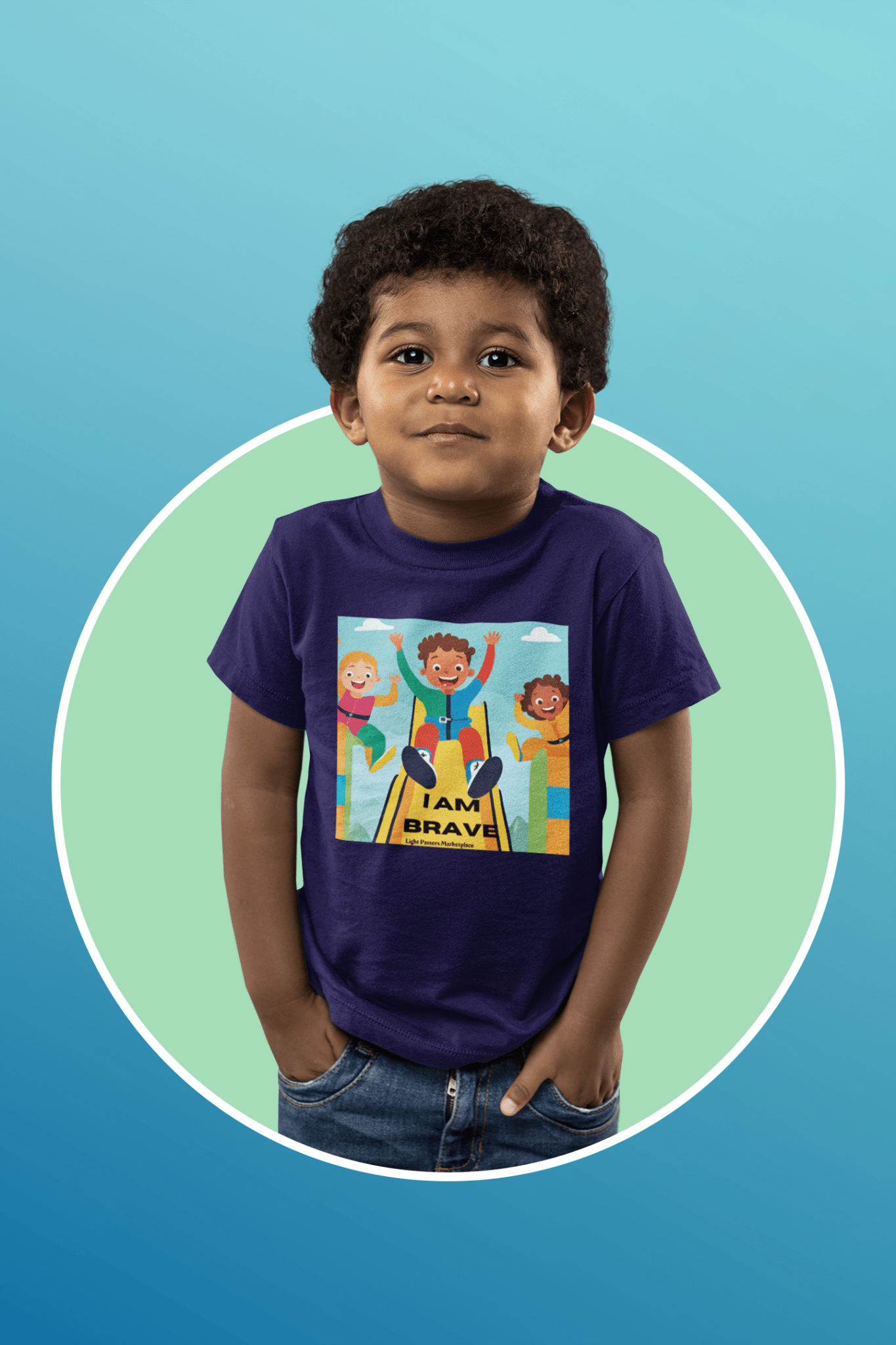 A boy in a blue shirt on a slide, wearing a tee with I am Brave print. Soft, 100% cotton fabric, tear-away label, classic fit, ideal for toddlers.