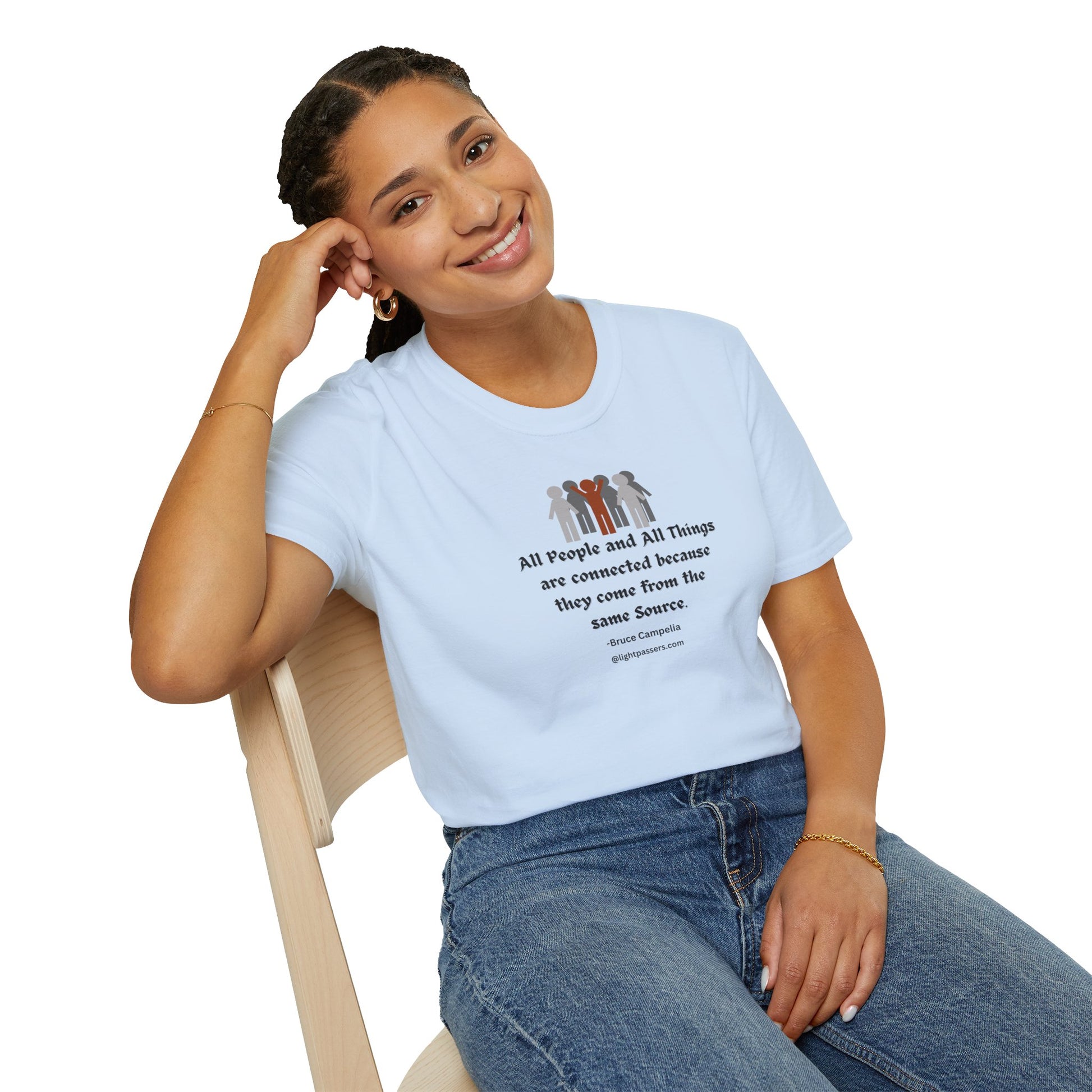 A woman in a white shirt sits on a chair, smiling. Unisex heavy cotton tee with smooth surface for vivid printing. No side seams for comfort.