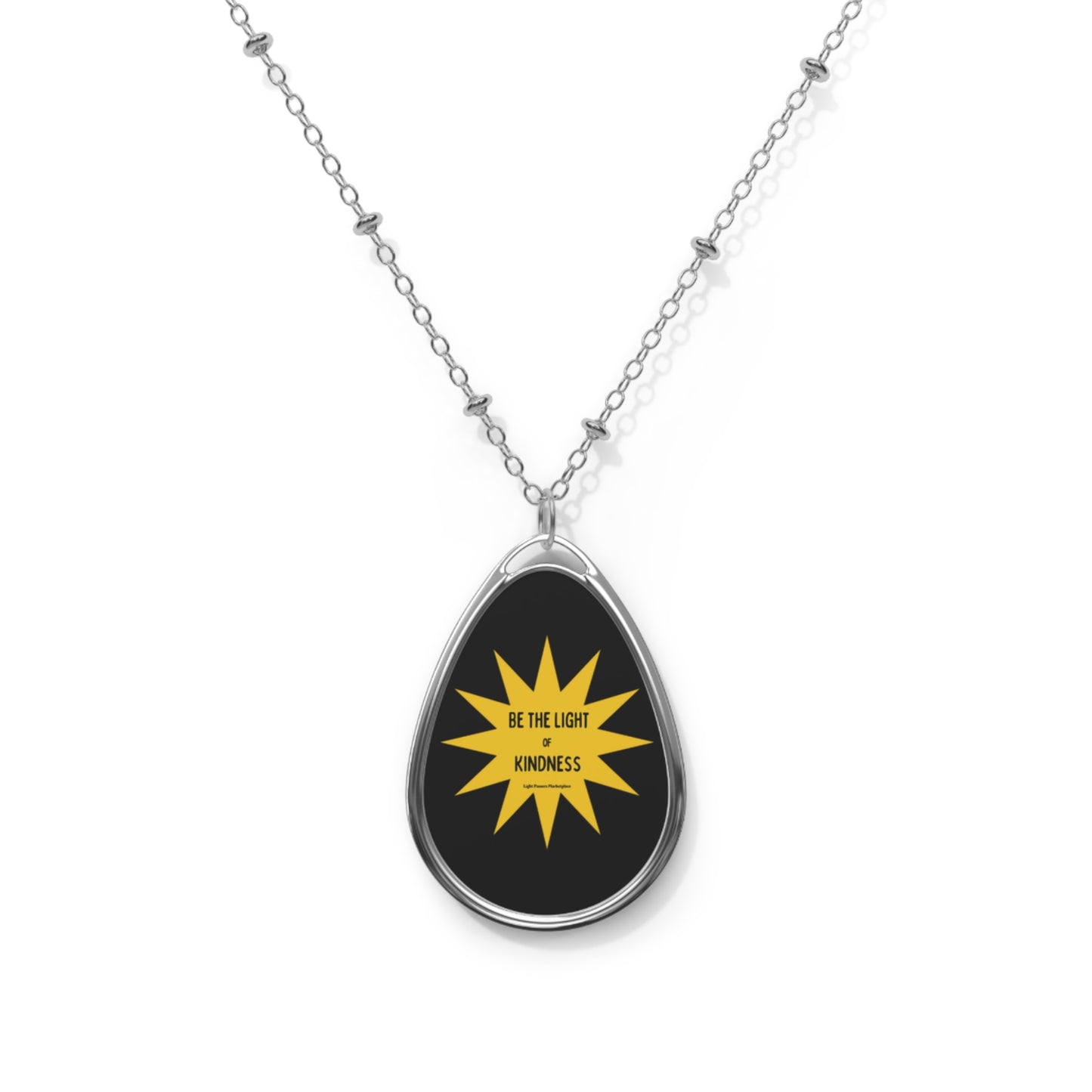 Necklace with Oval Pendant Be the Light of Kindness Cool Stuff Accessories featuring a silver chain and black-yellow star design pendant, perfect for gifting.