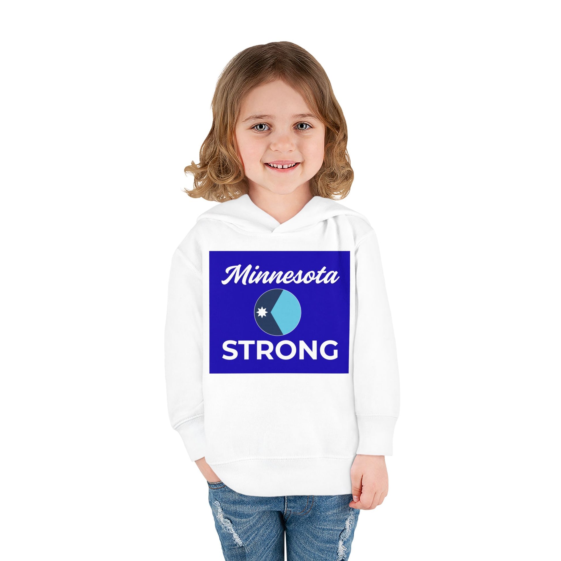 Toddler in Minnesota Strong hoodie with blue emblem, celebrating state pride. Perfect for warmth and comfort during playtime and family outings.