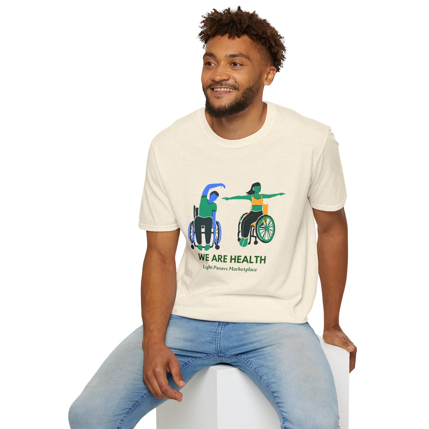 A man and a woman in wheelchairs practice yoga on a white surface, showcasing the Wheelchair Yoga Unisex T-Shirt. Made of soft 100% cotton with twill tape shoulders for durability, this tee offers comfort and style year-round. Ethically sourced and Oeko-Tex certified.