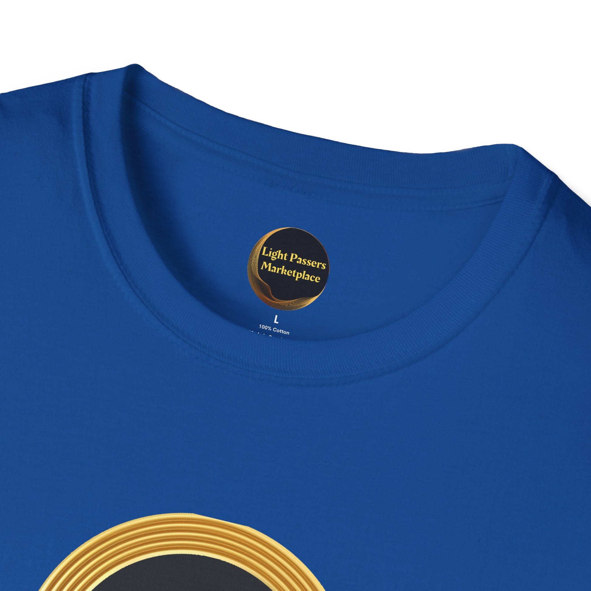 Close-up of Empowerment Tee neckline showing Light Passers Marketplace label, part of gold-ring graphic, and size details on royal-blue, 100% cotton fabric.