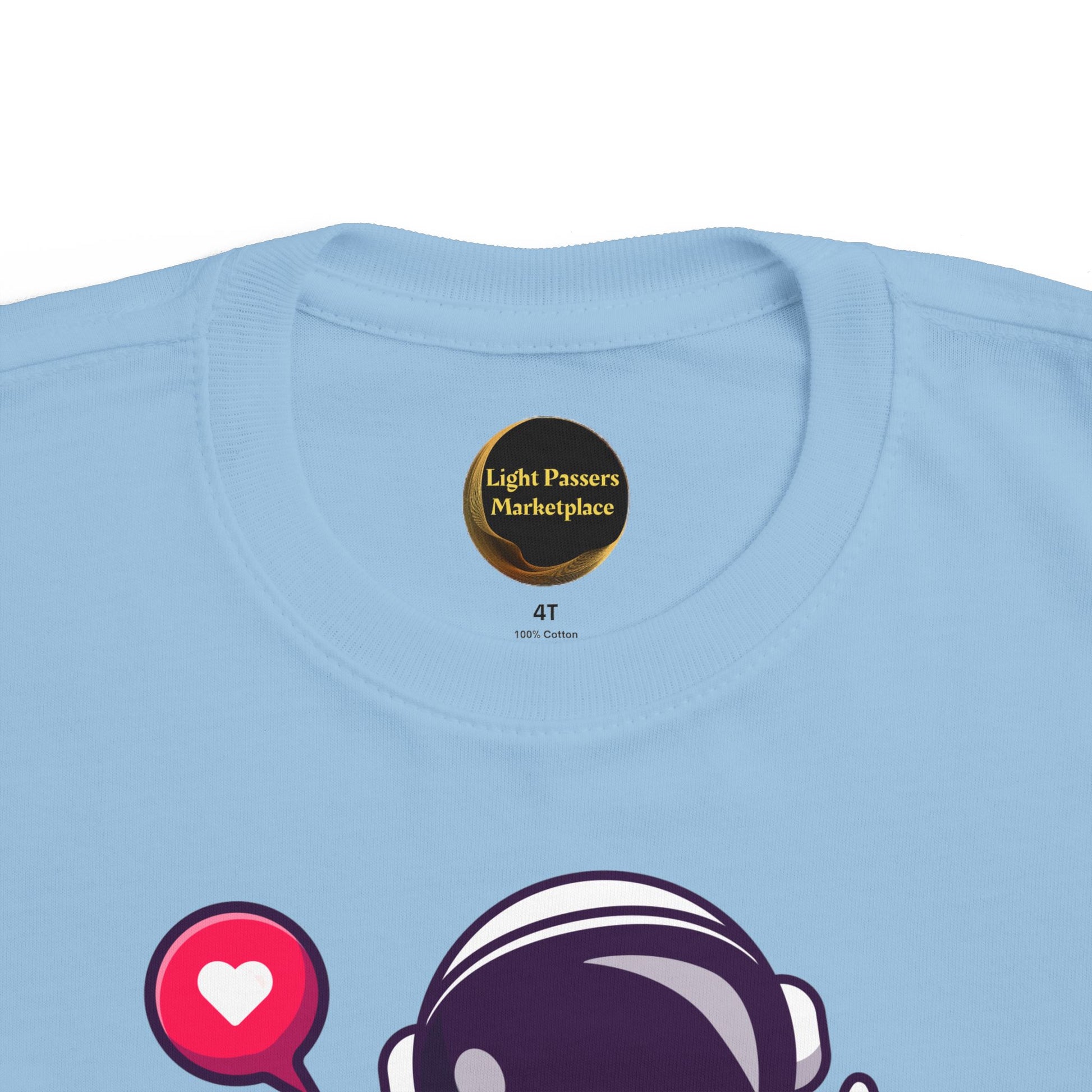 Peace Astronaut Toddler T-shirt featuring a light blue cotton fabric with a colorful astronaut helmet and heart graphic, perfect for sensitive skin.