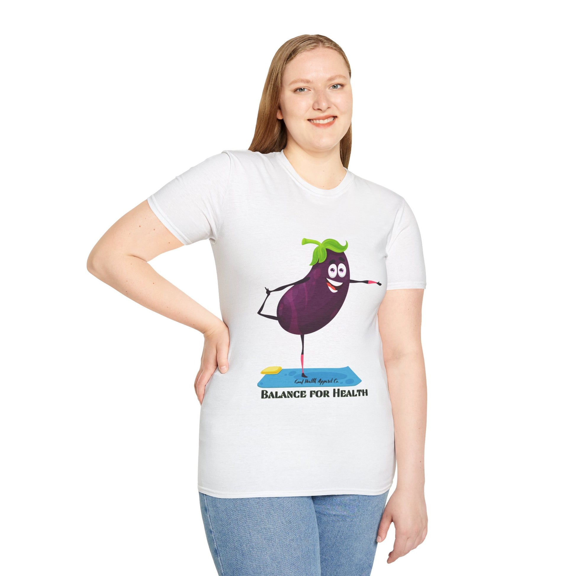 A woman in a white shirt with a cartoon eggplant design poses, showcasing the Eggplant Balance for Health Unisex T-Shirt. Made of soft 100% cotton, featuring twill tape shoulders for durability and a ribbed collar.