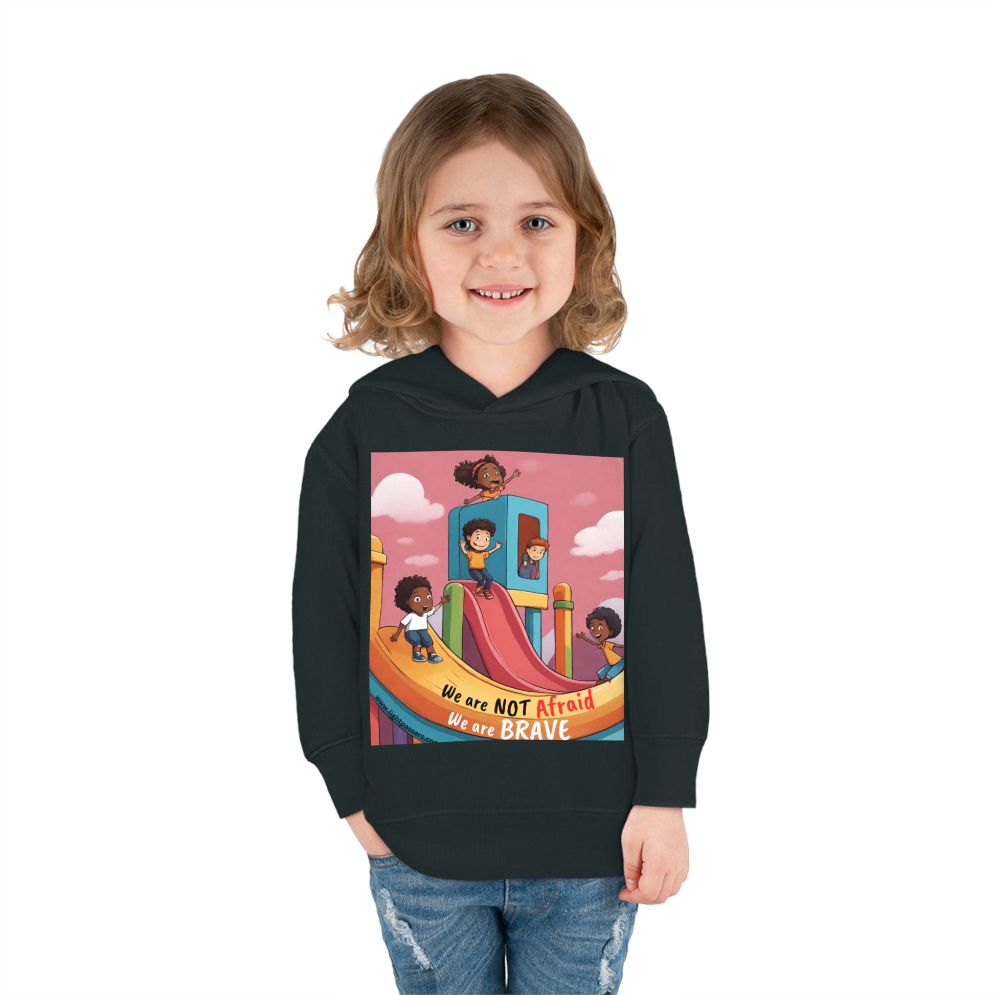 A smiling toddler in a Rabbit Skins hoodie, featuring a jersey-lined hood and durable stitching. Side-seam pockets and cozy design for lasting comfort.