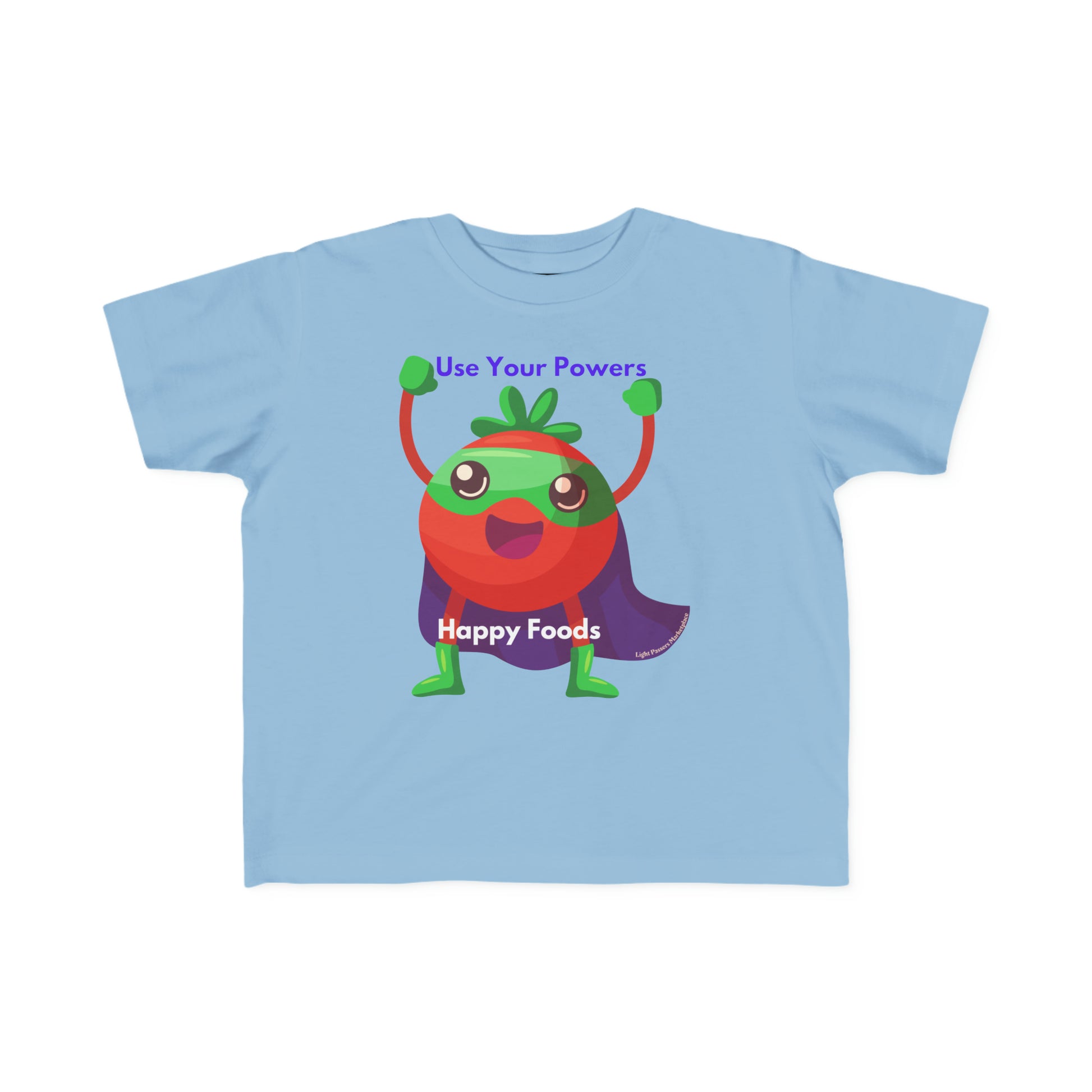 A toddler's Tomato Power tee in blue, featuring a cartoon character with a cape and legs. Soft, durable 100% combed cotton, light fabric, tear-away label, classic fit. Ideal for sensitive skin.