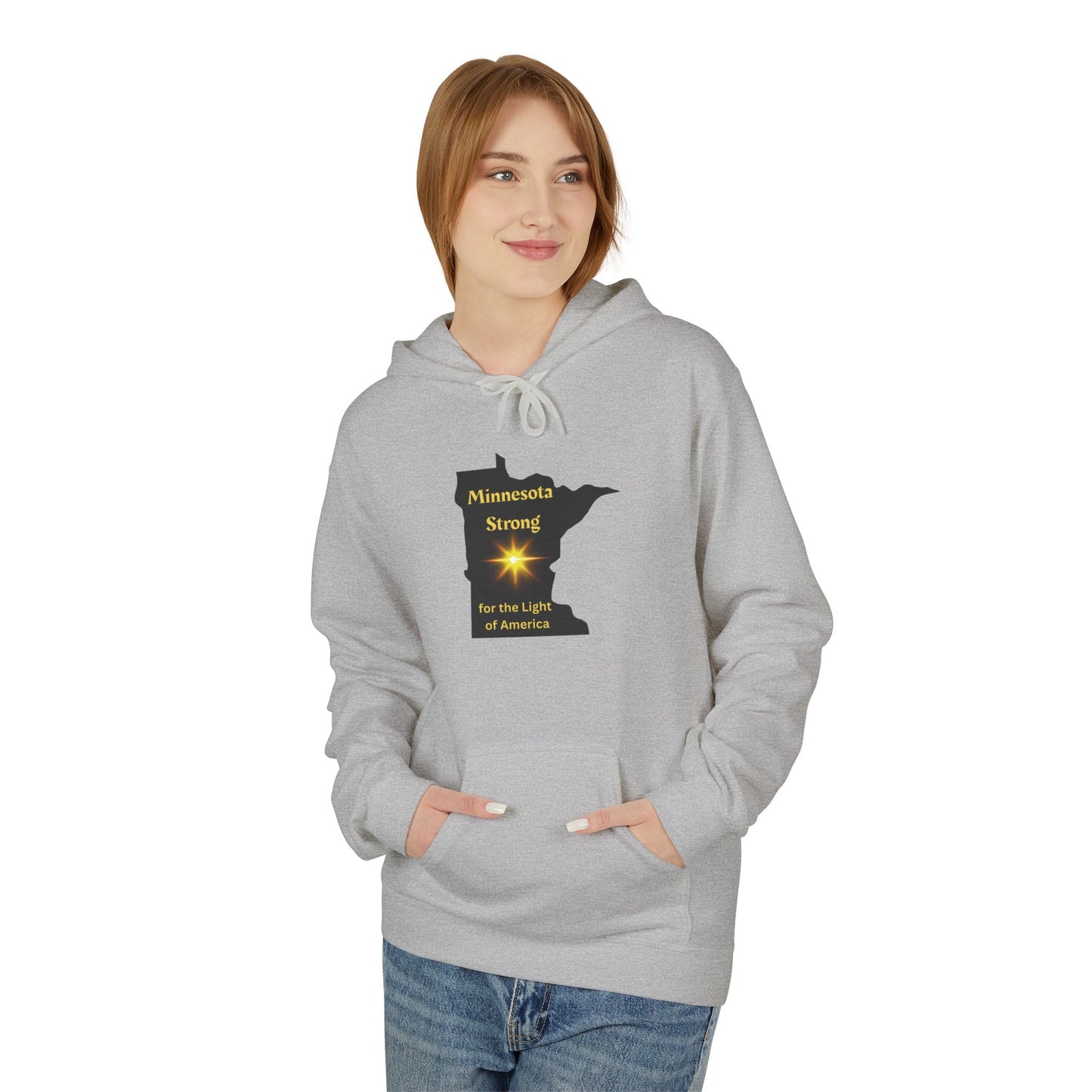 Female model in light-gray Love and Peace The Light hoodie featuring Minnesota Strong design, gold lettering, star graphic; embodies comfort and community spirit.