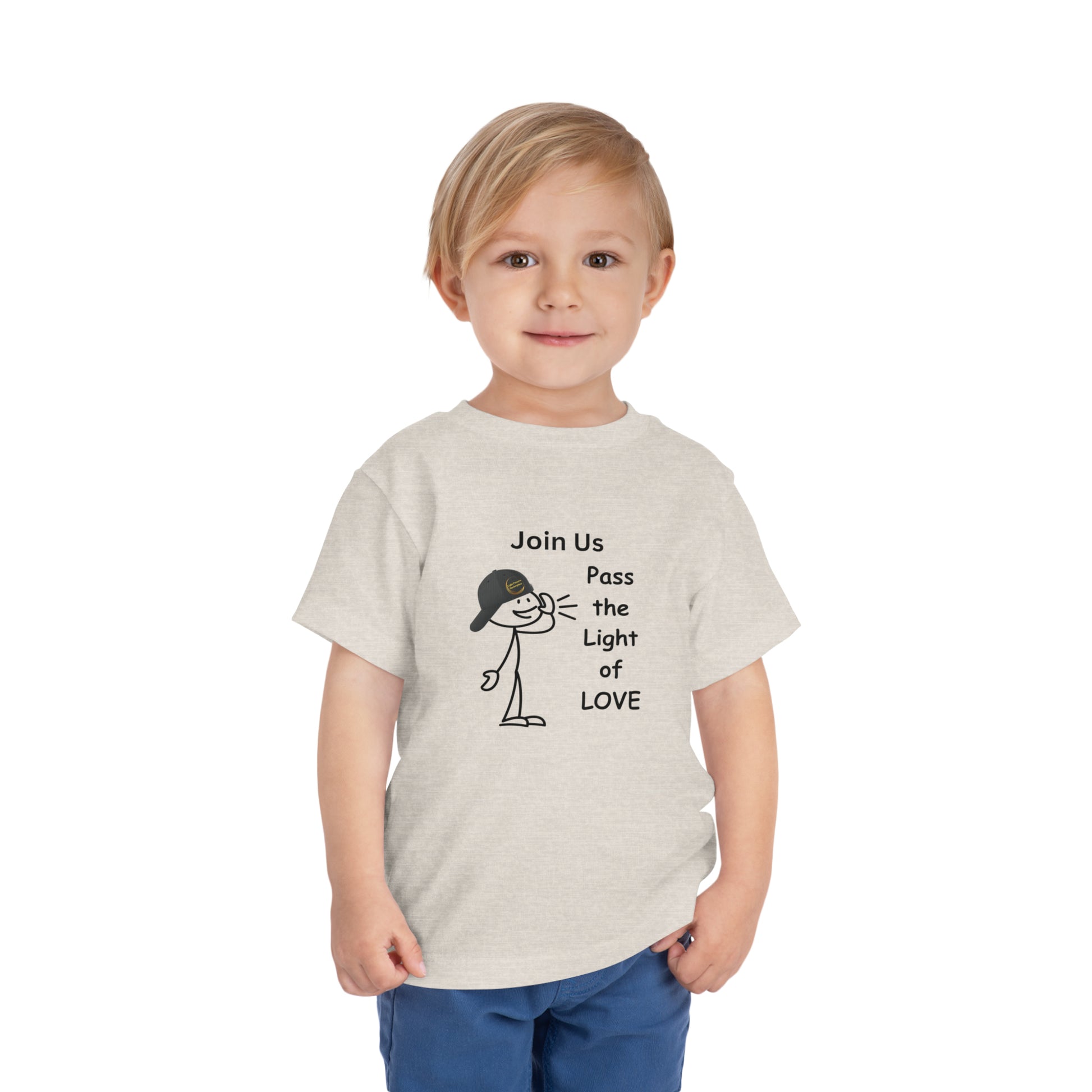 A child in a white Call Pass the Light of Love toddler t-shirt, featuring a cartoon stick figure with a hat. Made of 100% Airlume cotton, tear-away label for comfort.