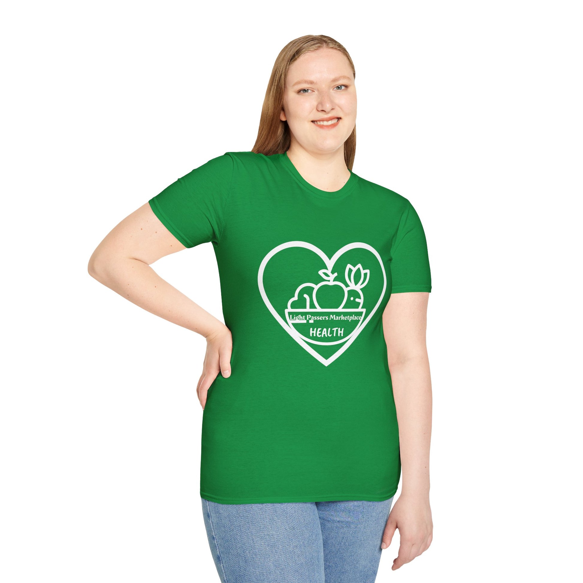 A woman in a green shirt with a heart logo, paired with blue jeans, showcasing Light Passers Marketplace Fruit Basket Unisex T-Shirt's casual comfort and durable design.