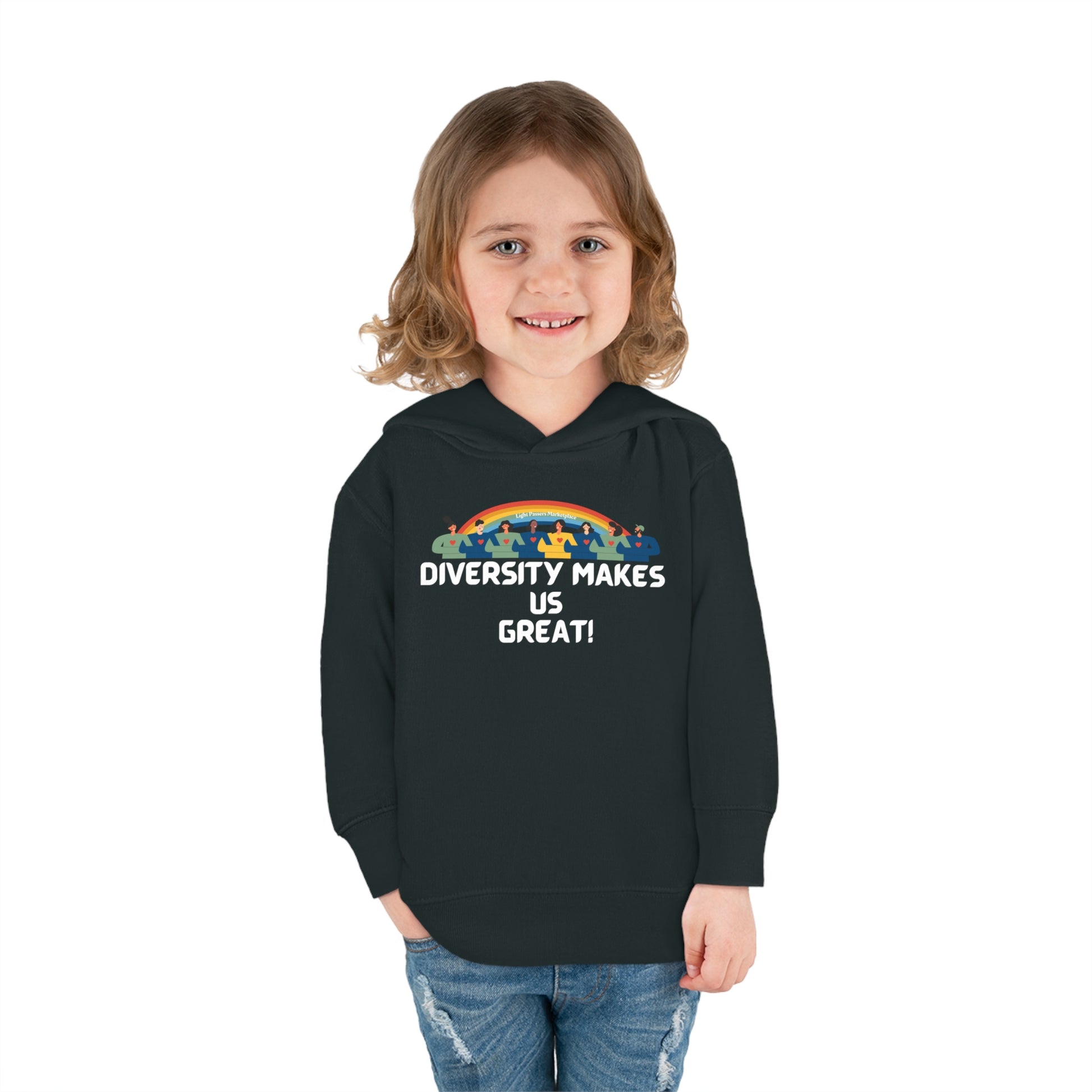 A smiling child in a black Rainbow hoodie with side seam pockets and cover-stitched details. Made of 60% cotton, 40% polyester for lasting coziness.