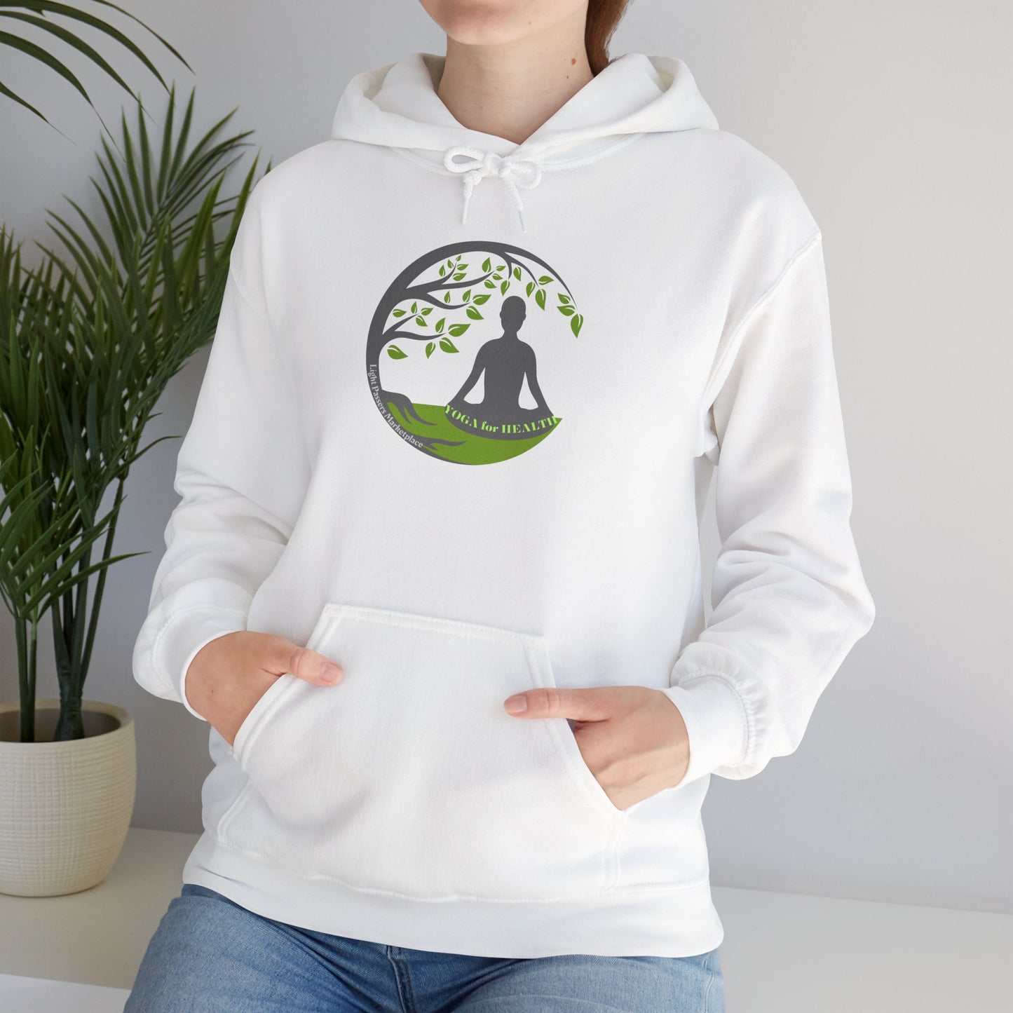 A person in a white hoodie with a logo, embodying comfort and style. Made of 50% cotton and 50% polyester, featuring a kangaroo pocket and color-matched drawstring for a cozy, fashionable look.