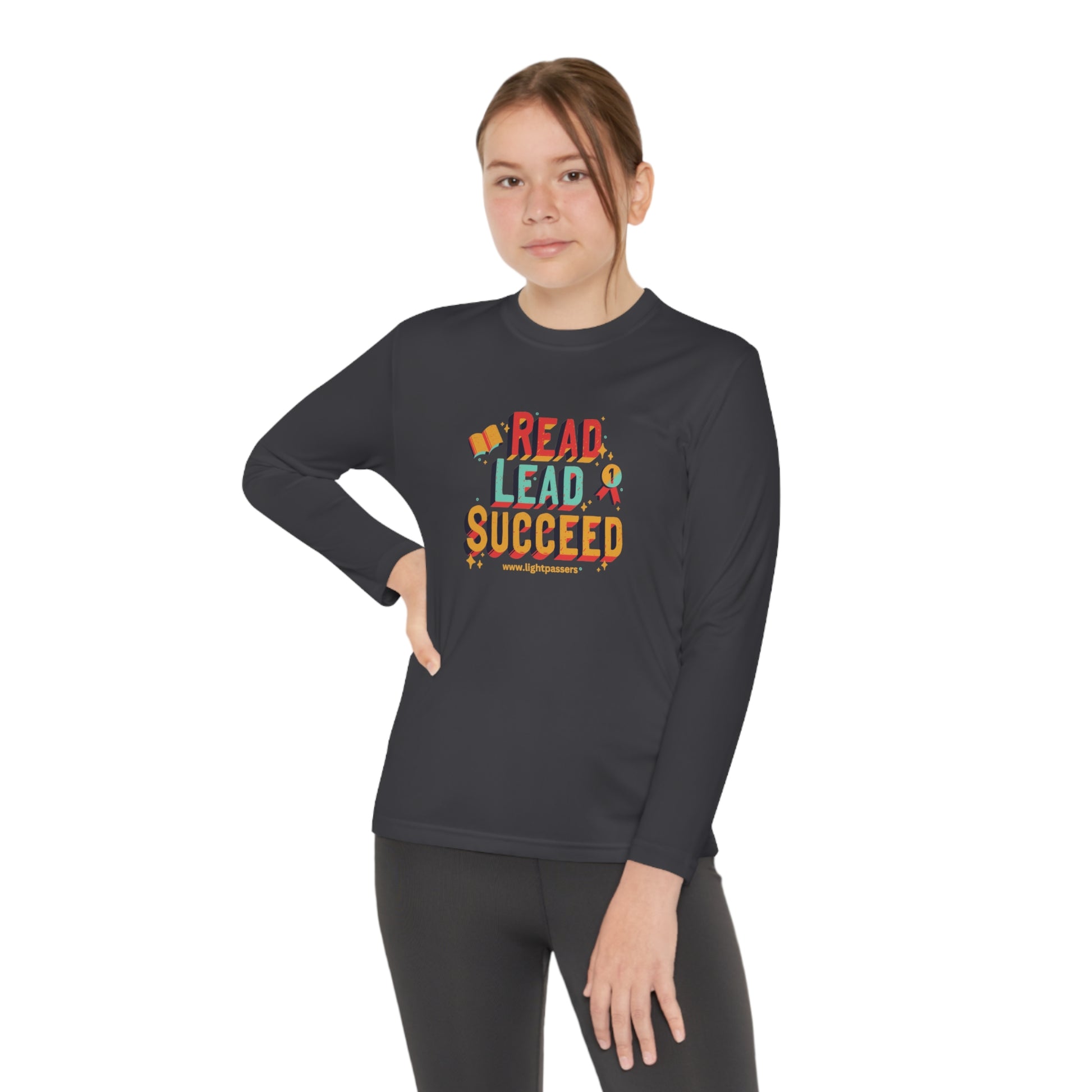 Youth wearing the Long Sleeve Read Lead and Succeed shirt, featuring an athletic fit, ideal for active book lovers and students.