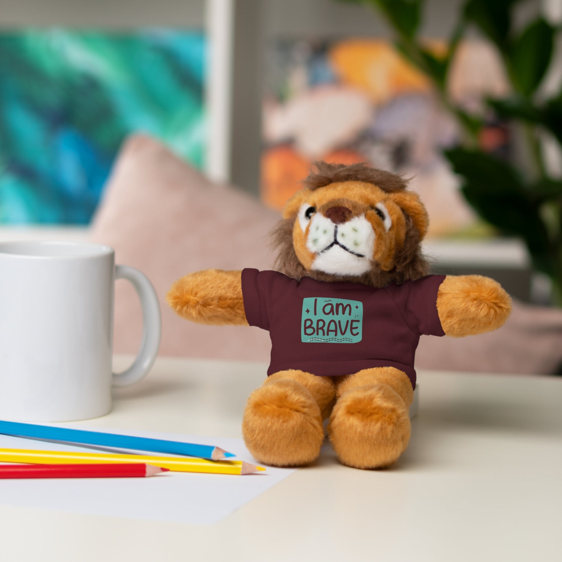 Cool Stuff Stuffies: A stuffed lion toy with a removable I am Brave tee, part of a six-animal customizable collection for comfort and decor.