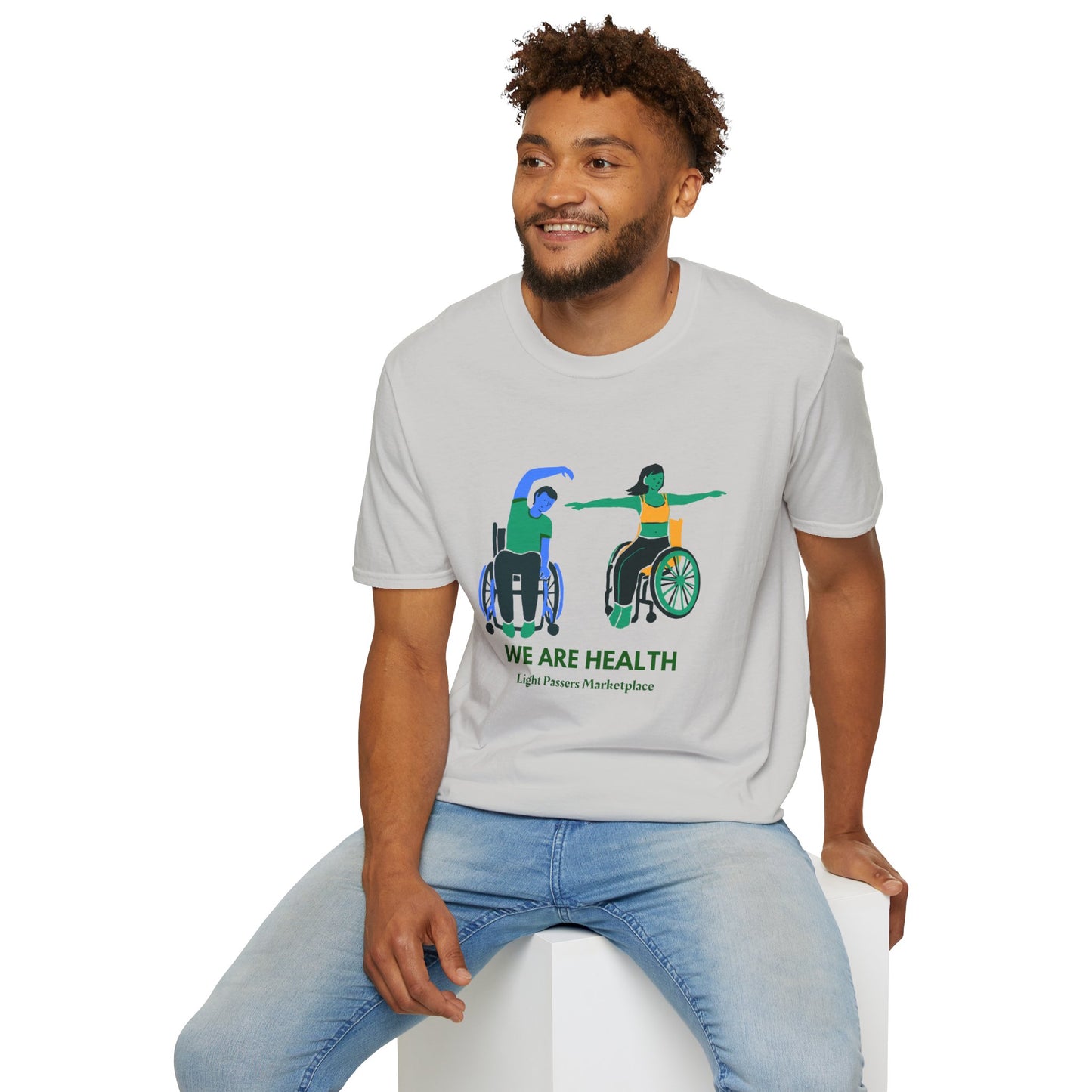 A man in a wheelchair practices yoga on a soft, 100% cotton unisex t-shirt. Ethically made with twill tape shoulders and ribbed collar for durability and comfort.