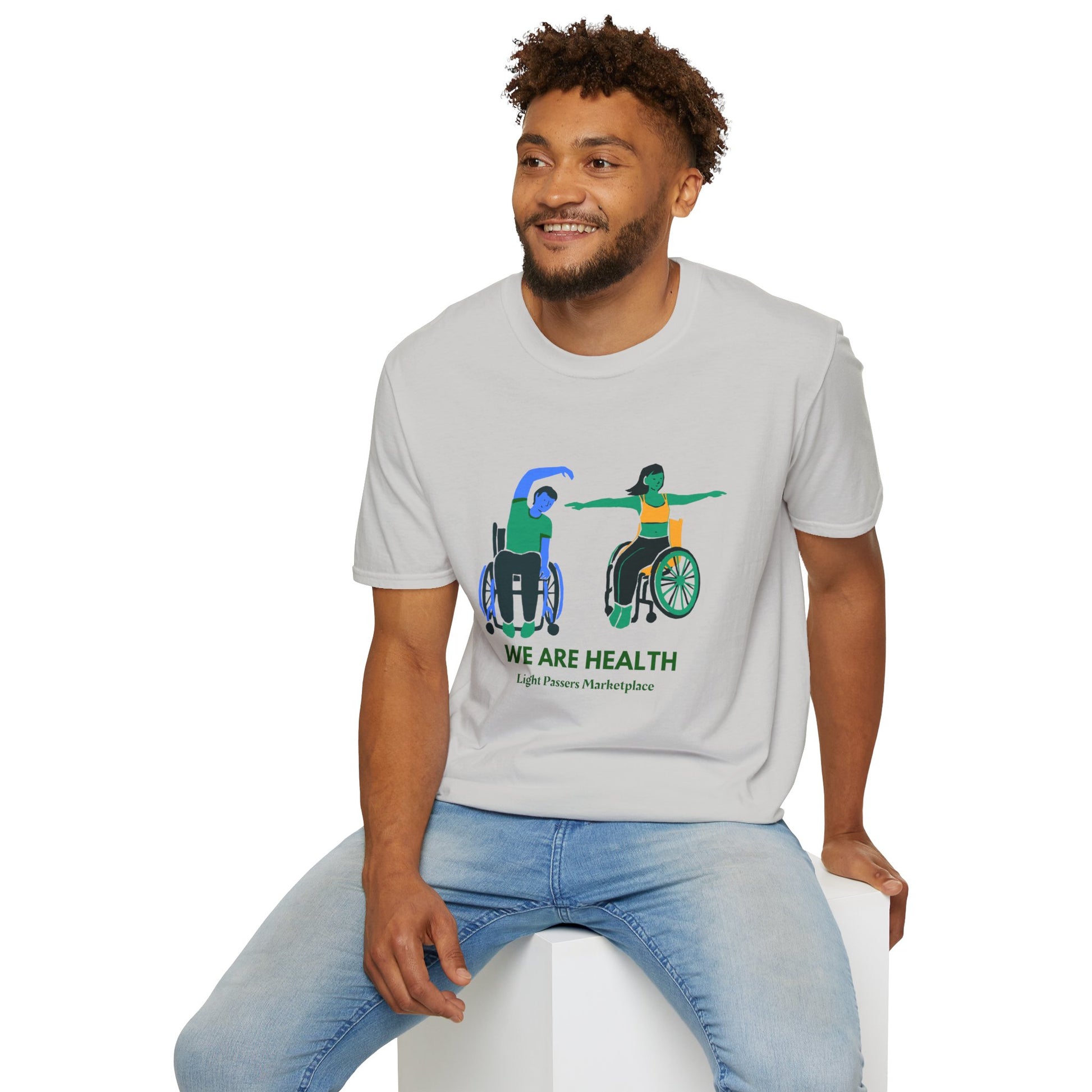 A man in a wheelchair practices yoga on a soft, 100% cotton unisex t-shirt. Ethically made with twill tape shoulders and ribbed collar for durability and comfort.