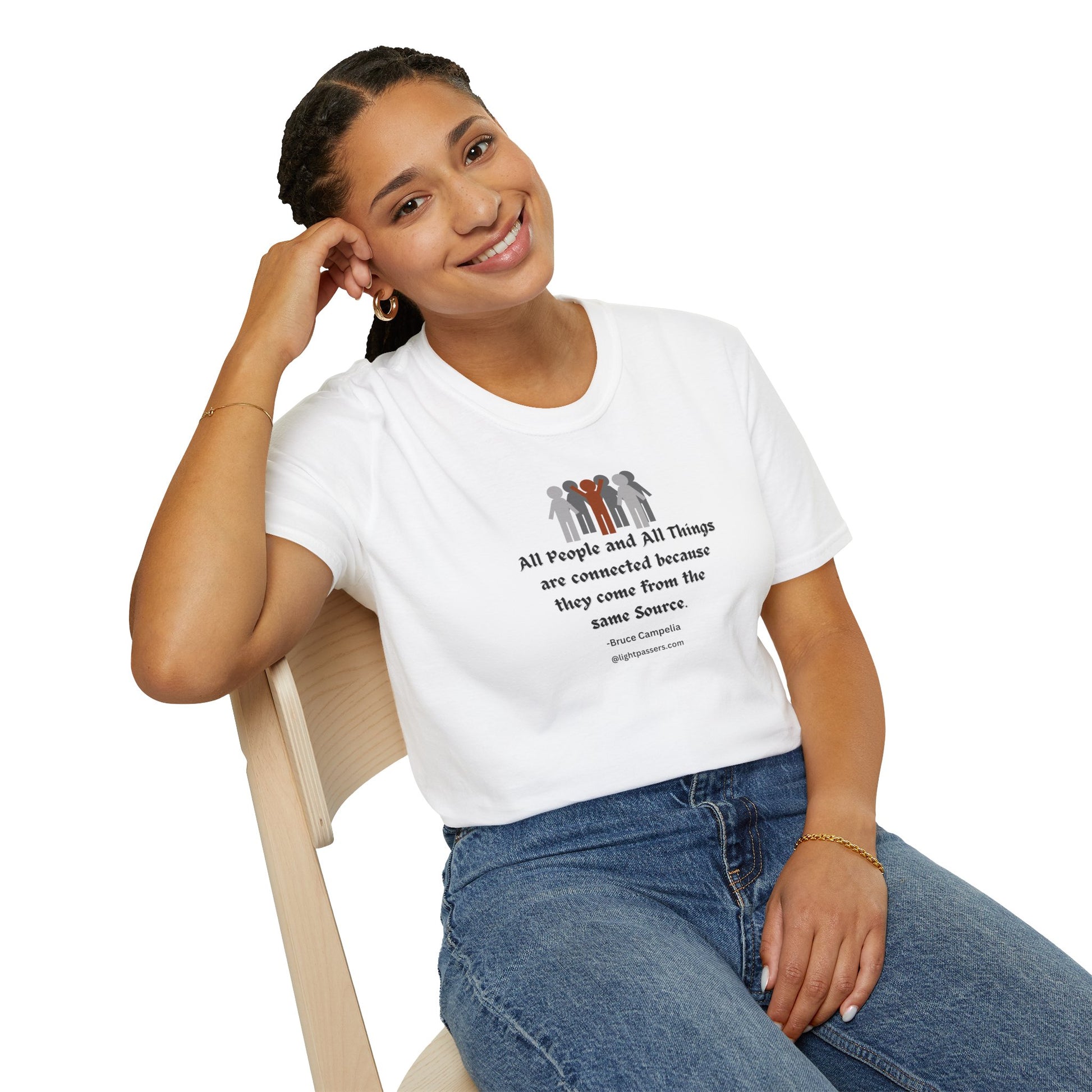 A woman in a white shirt and blue jeans sits on a chair, showcasing the All People are Connected red and gray design Unisex T-shirt. The image emphasizes casual fashion with a focus on the tee's quality and comfort features.