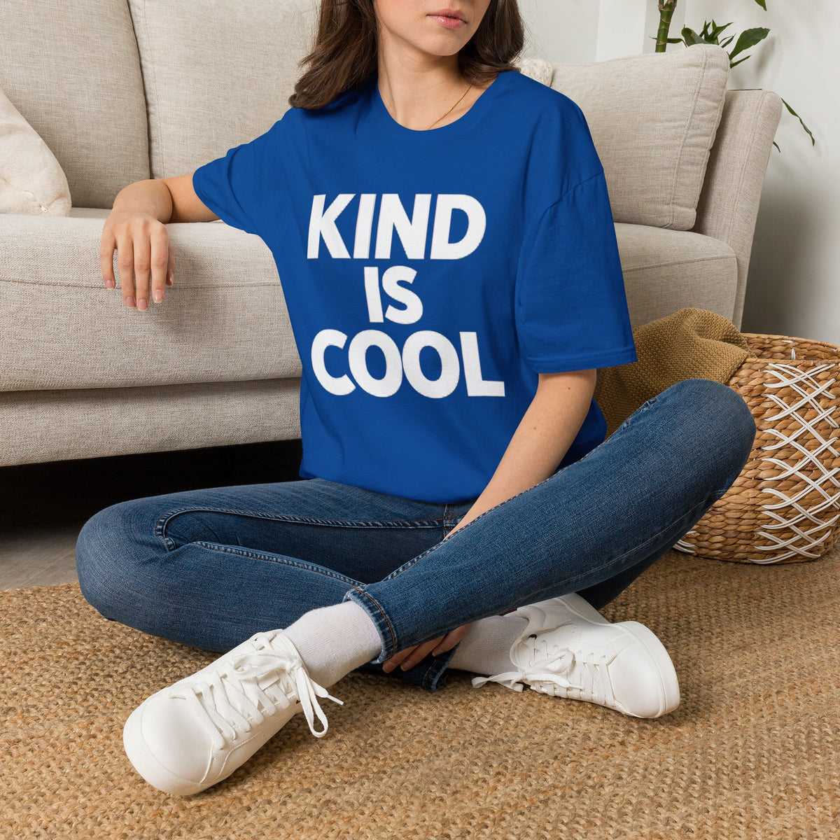 Royal blue unisex T-shirt with large text graphic reading “KIND IS COOL”