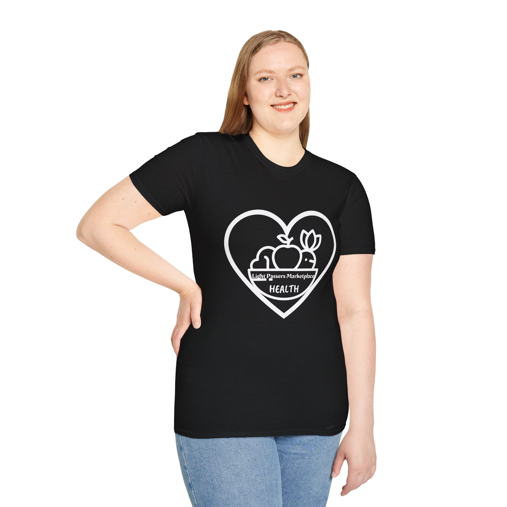 A woman in a black shirt poses, showcasing the Light Passers Marketplace Fruit Basket Unisex T-Shirt. The image features a heart logo, blue jeans, and a black and white fruit design.