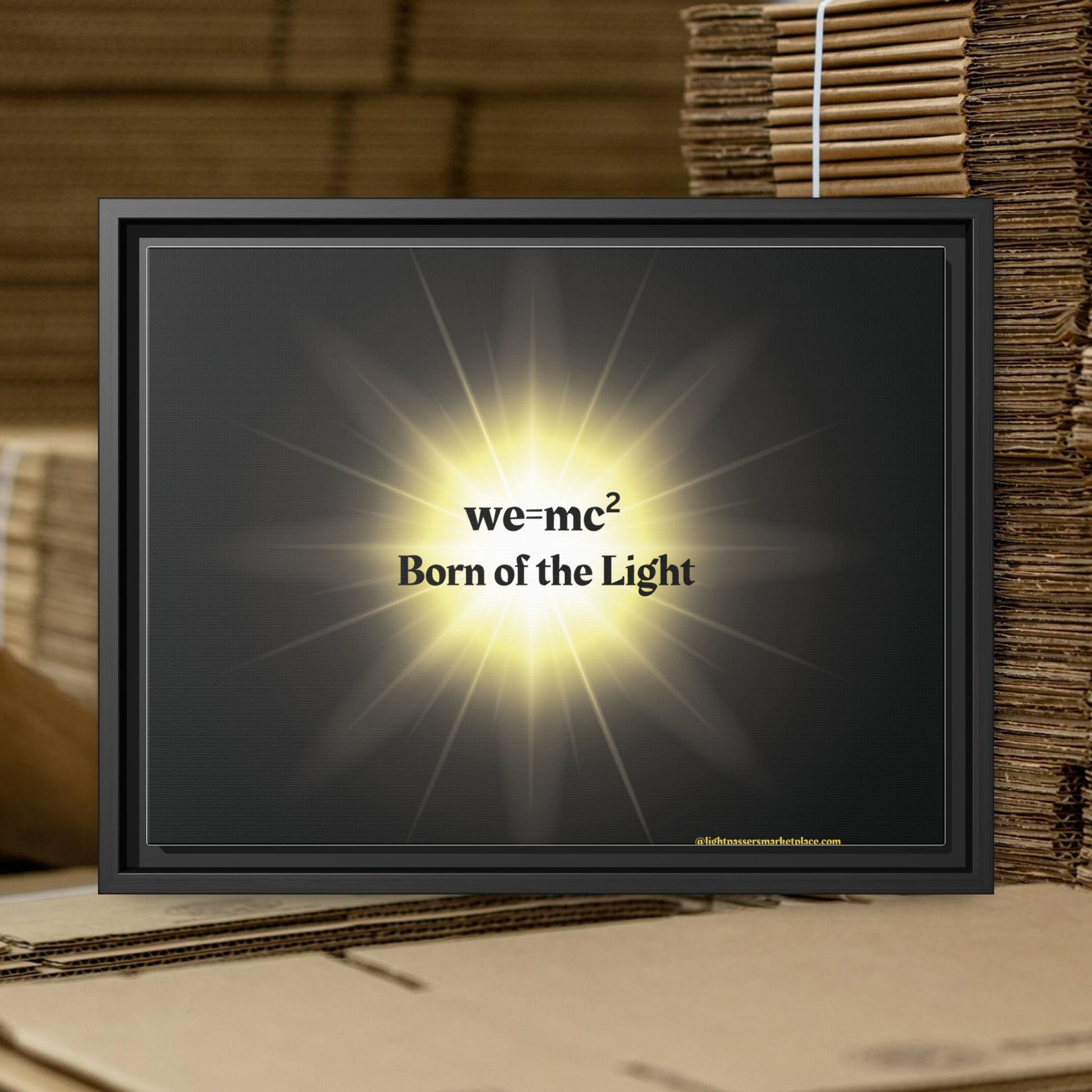 Inspirational Framed Canvas Art - we=mc² Born of the Light, featuring a black frame and glowing artwork, ideal for uplifting any space.