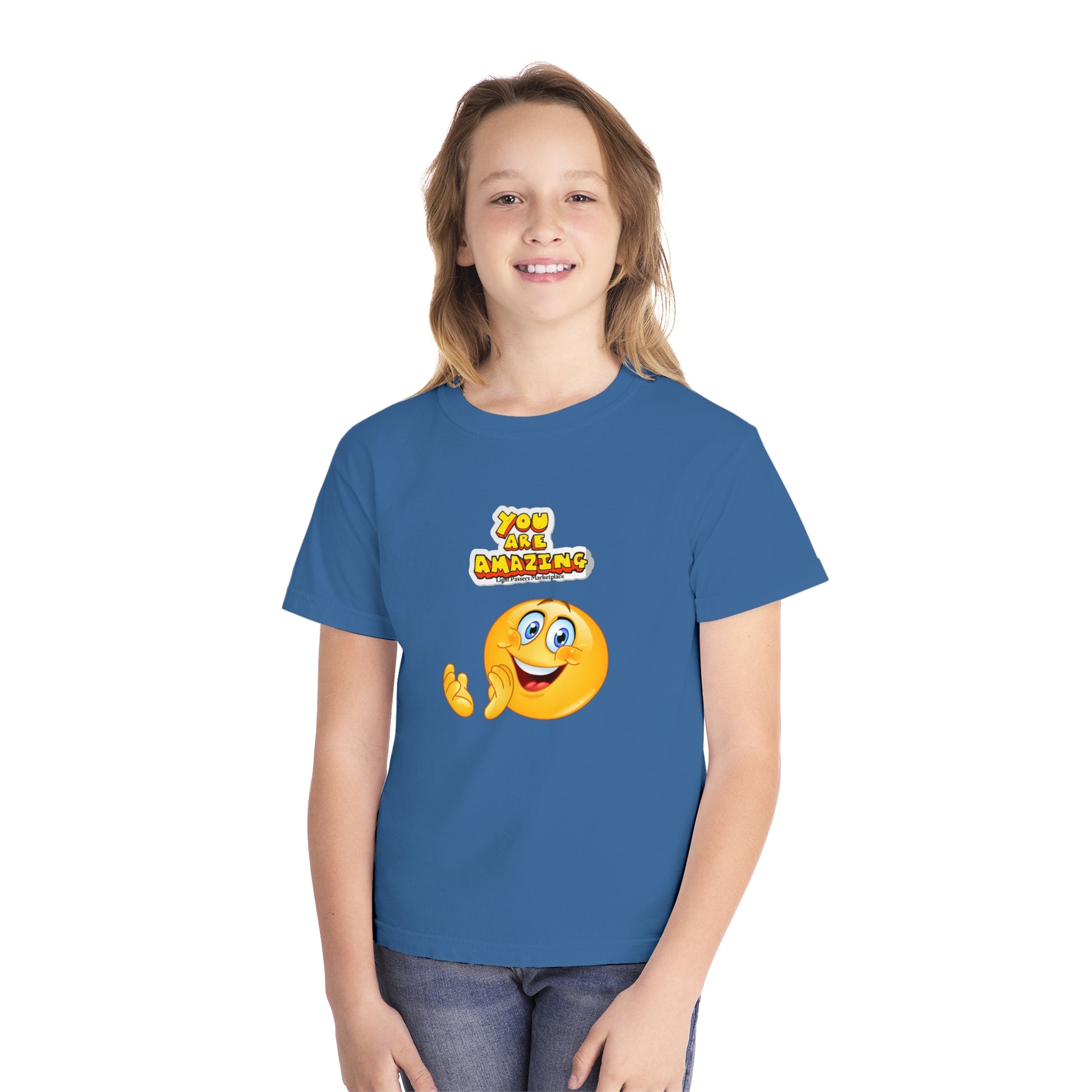 A youth t-shirt featuring a girl in a blue shirt, embodying comfort and agility. Made of 100% combed ringspun cotton, soft-washed, and garment-dyed for all-day wear.