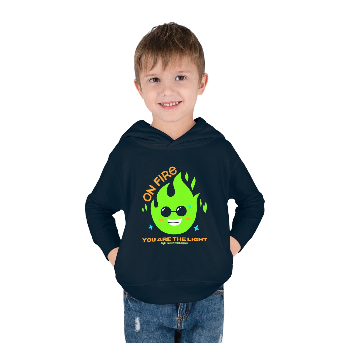 A toddler wearing a Rabbit Skins hoodie with a cartoon fire design, featuring side seam pockets and cover-stitched details for durability and comfort.