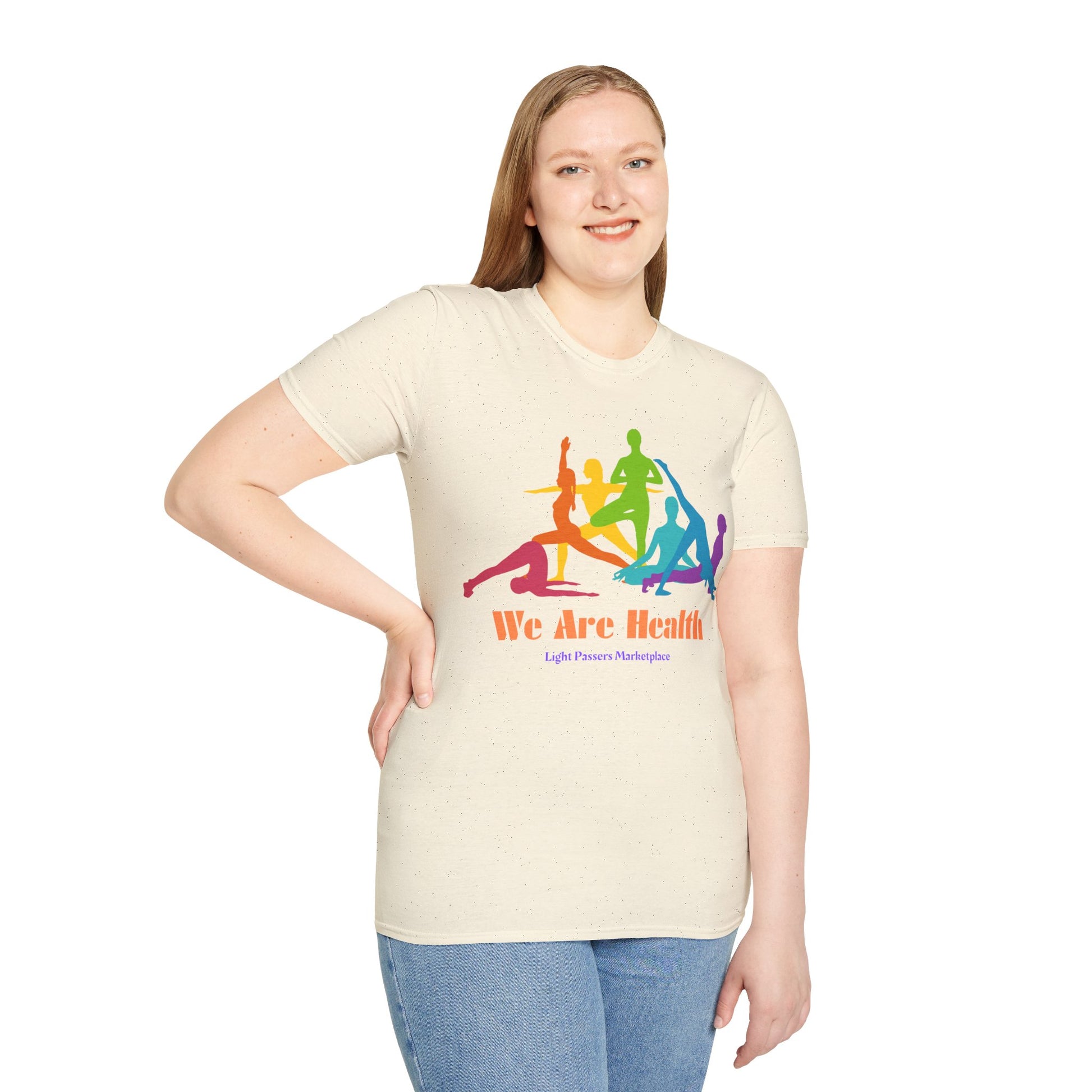 A woman in a white shirt with a colorful logo poses for a picture, showcasing the Yoga Class Unisex T-Shirt. Soft 100% cotton tee with twill tape shoulders, ribbed collar, and no side seams for ultimate comfort and durability.