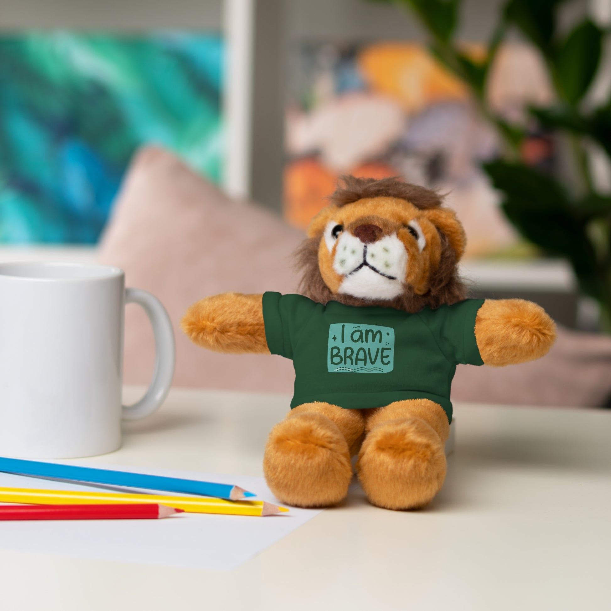 Stuffed lion toy from Cool Stuff Stuffies, featuring a removable tee with I am Brave message, perfect for cuddling and personalizing.