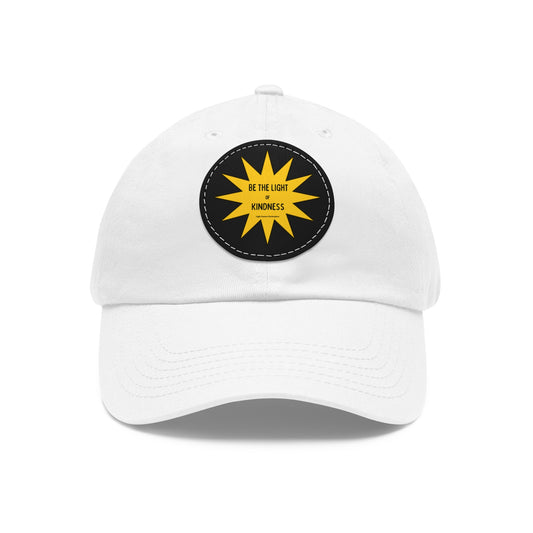 Unisex hat featuring a PU leather patch with Be the Light of Kindness yellow sun design, ideal for casual wear or gifting.