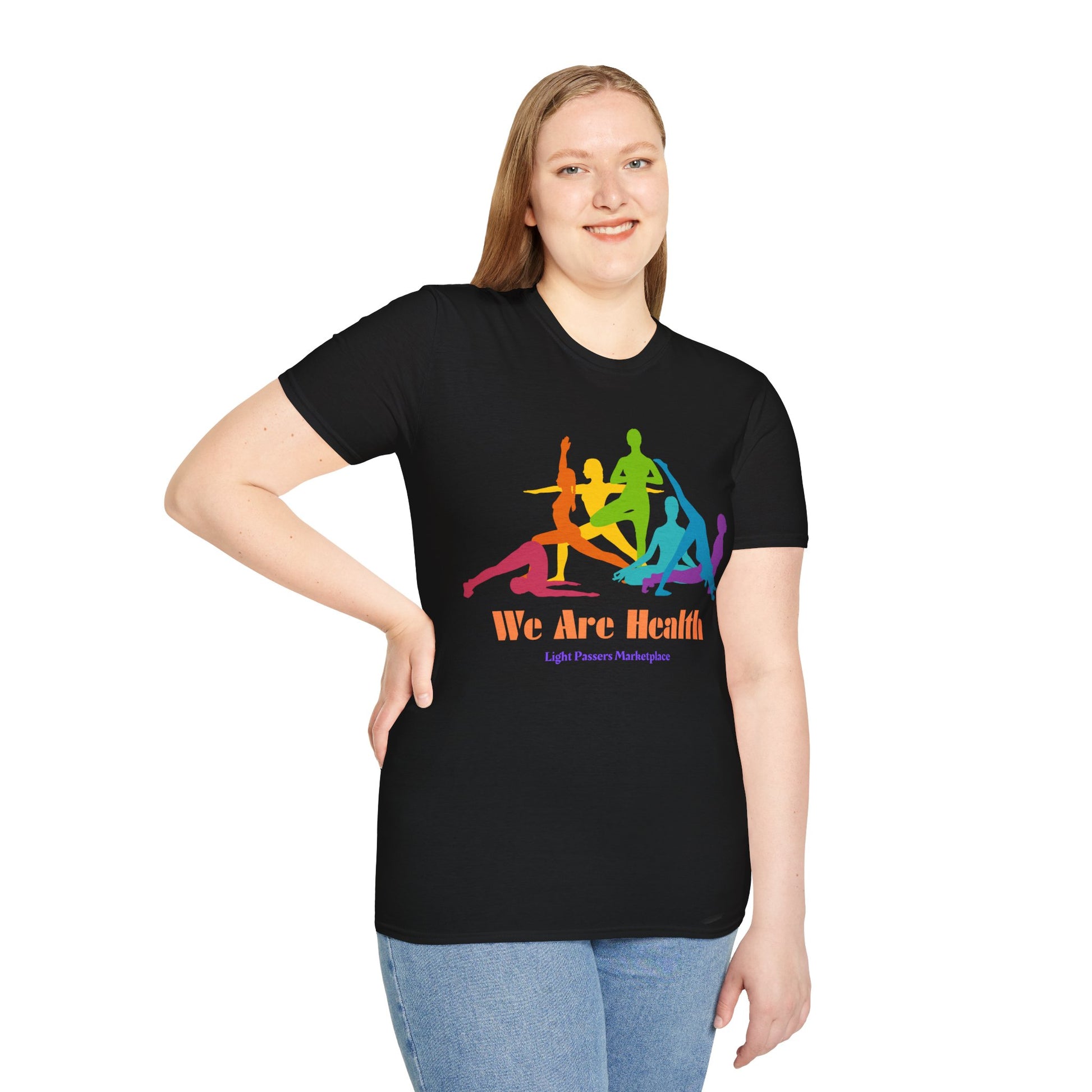 A woman in a black shirt with colorful text poses for a picture, showcasing the Yoga Class Unisex T-Shirt. Made of soft 100% cotton, featuring twill tape shoulders for durability and a ribbed collar.