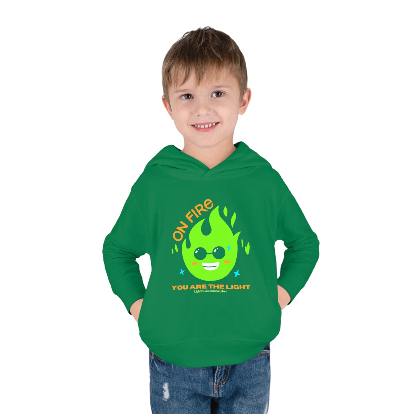 A toddler wearing a green hoodie with a flame design and text, featuring a jersey-lined hood and side seam pockets for comfort and durability.