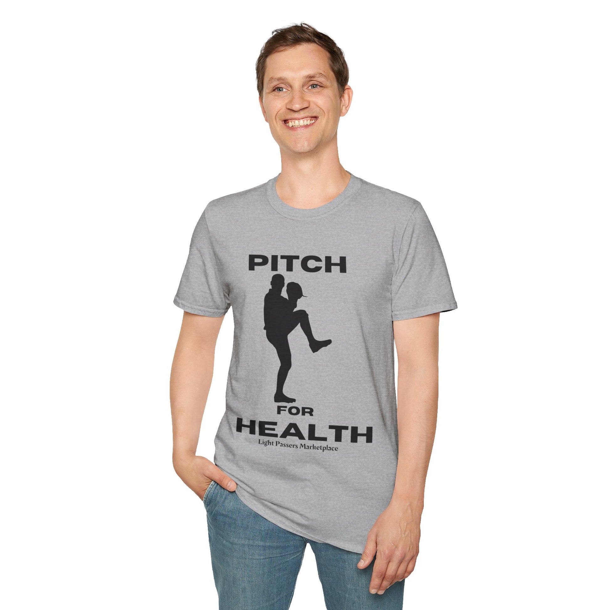 A man in a grey Pitch for Health unisex t-shirt with a baseball player graphic, showcasing casual comfort and durability. Made from soft 100% cotton, featuring twill tape shoulders and a ribbed collar.