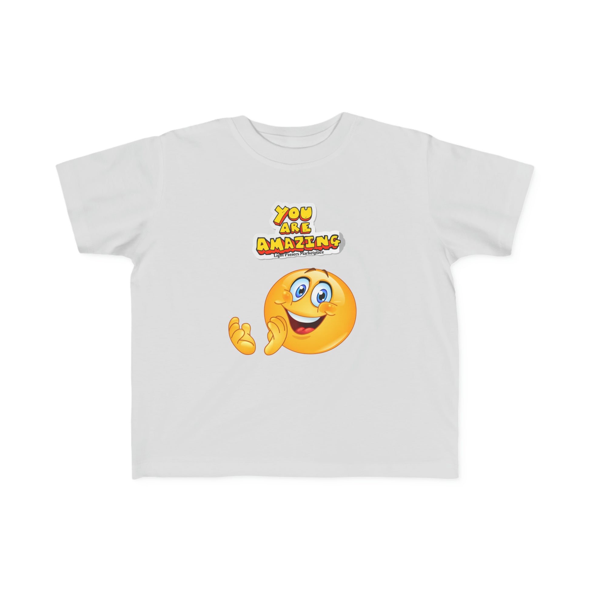 A white toddler t-shirt featuring a cartoon face design, made of soft 100% combed, ring-spun cotton. Durable print, light fabric, tear-away label, classic fit, true to size.